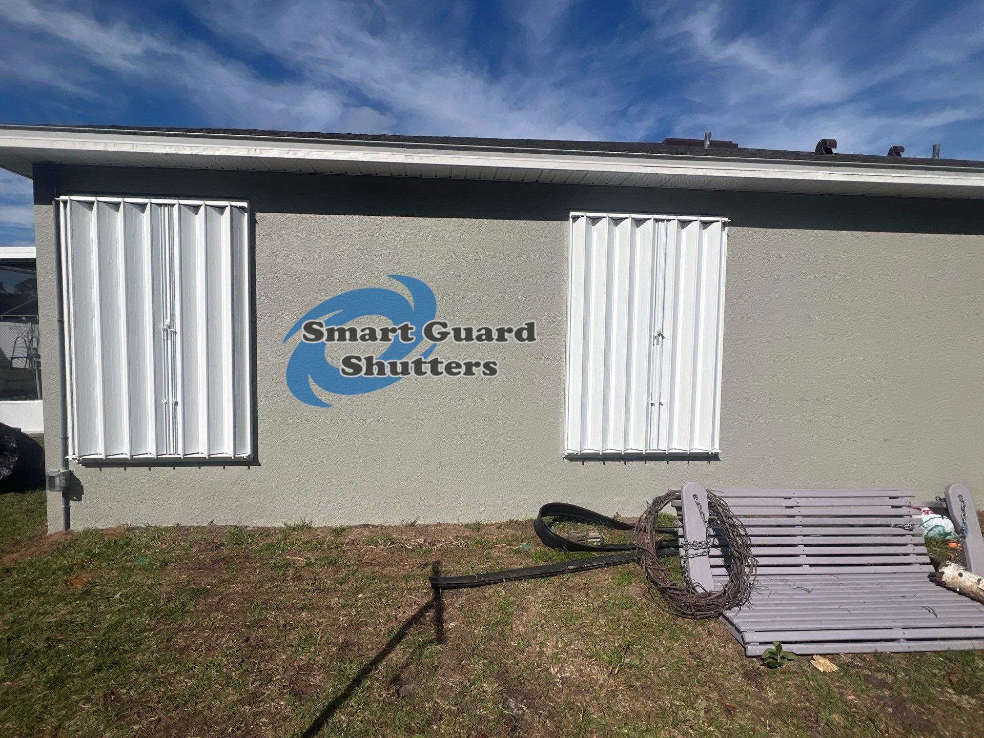 Accordion Shutters in White by Smart Guard Shutters