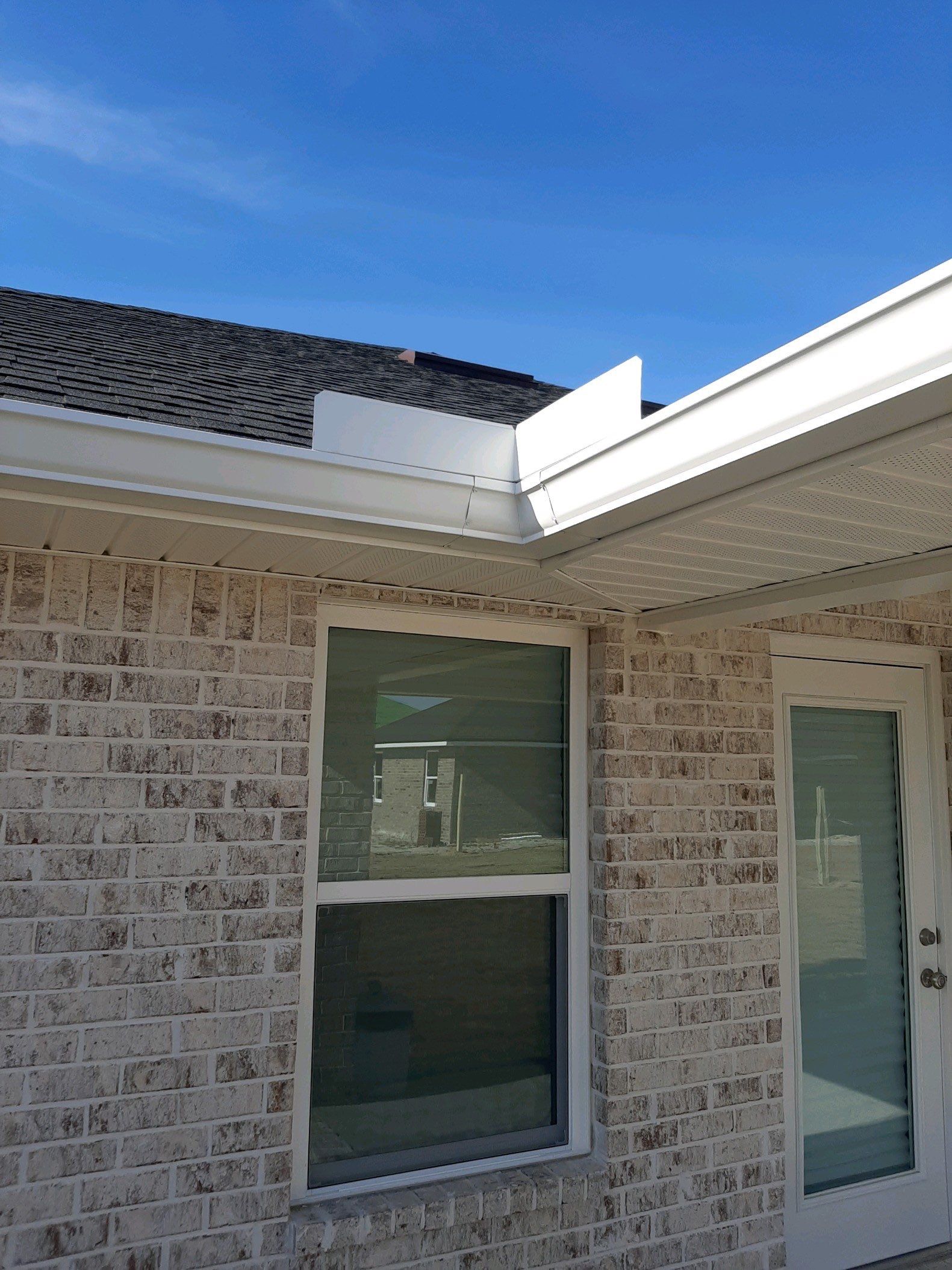 Seamless Gutter Installation Using White K-Style Gutters by Gutter Professors