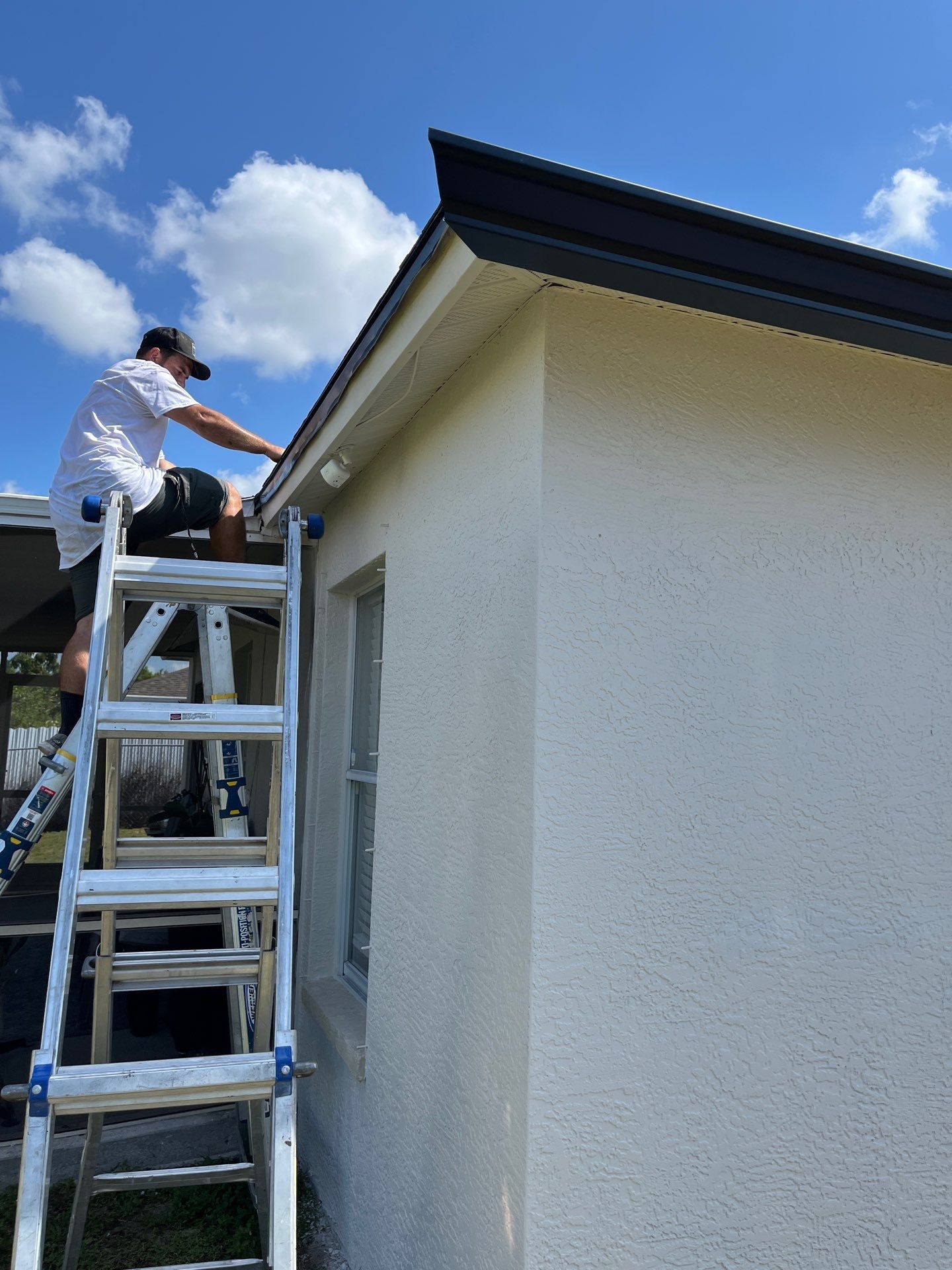 Black Seamless Gutters and Downspouts in Fort Myers FL by Gutter Professors