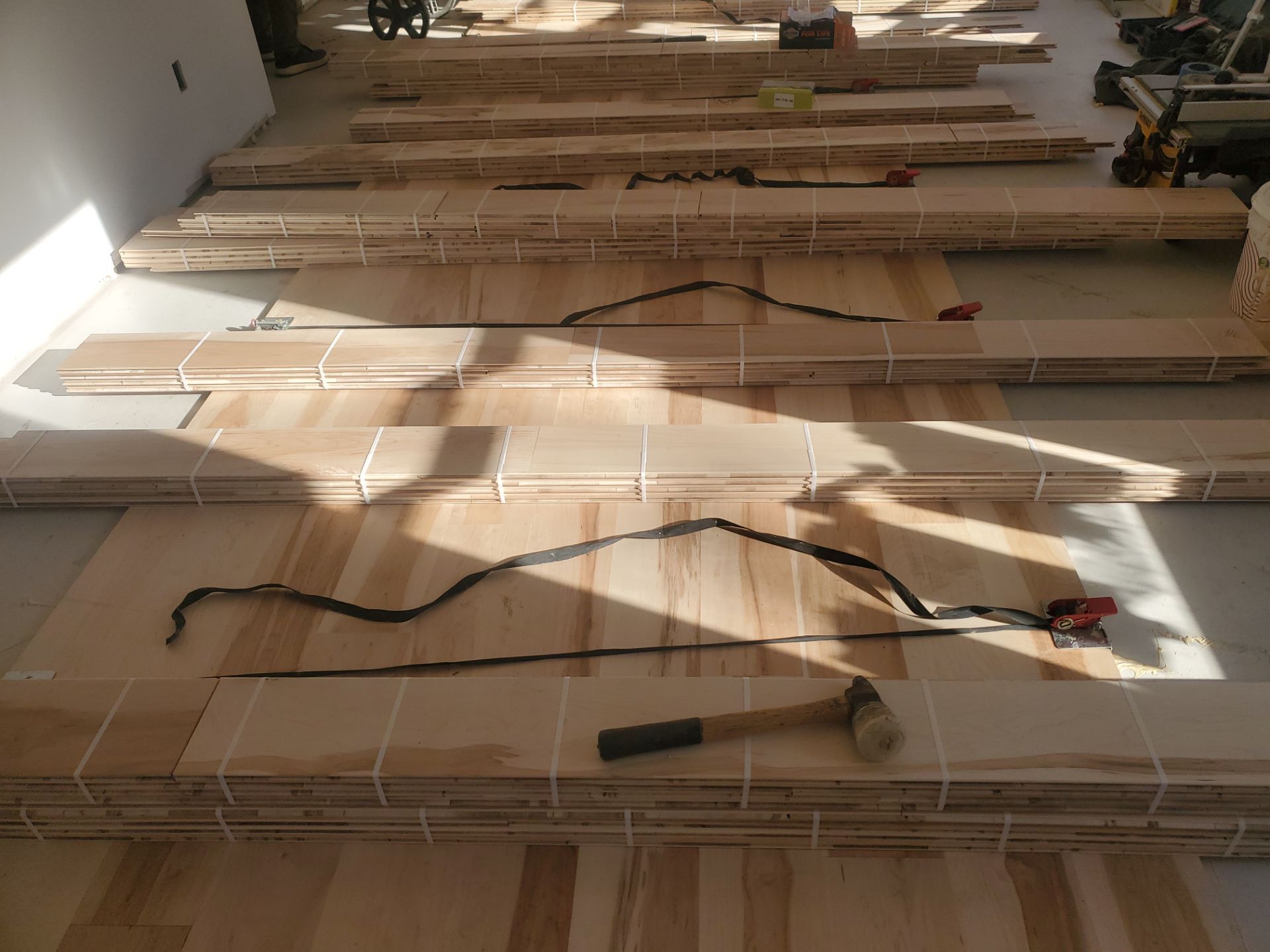 Full glue down Installation over radiant heat 7" Maple character grade by Ann Arbor Hardwoods 