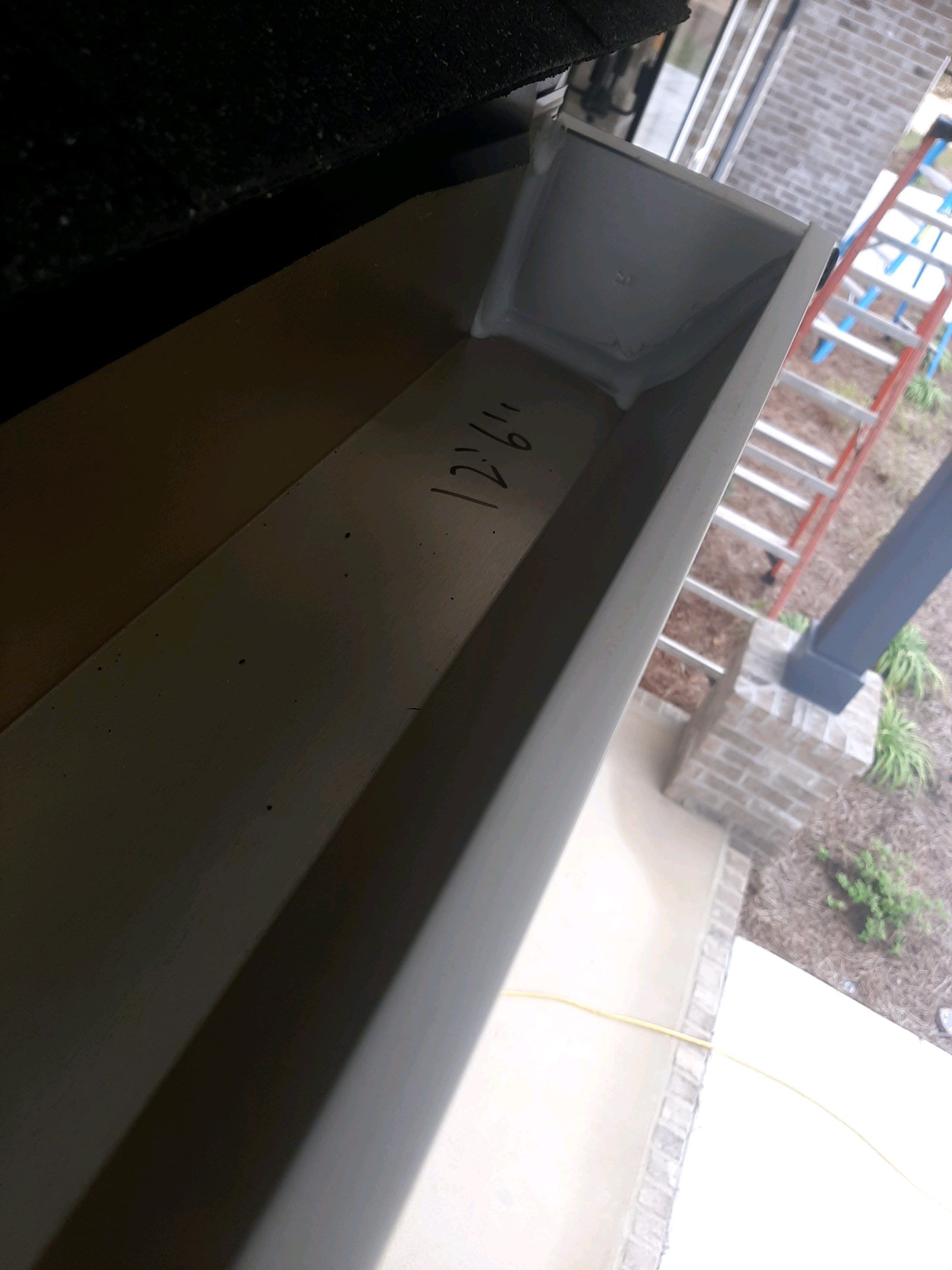 Seamless Gutter Installation Using White K-Style Gutters by Gutter Professors