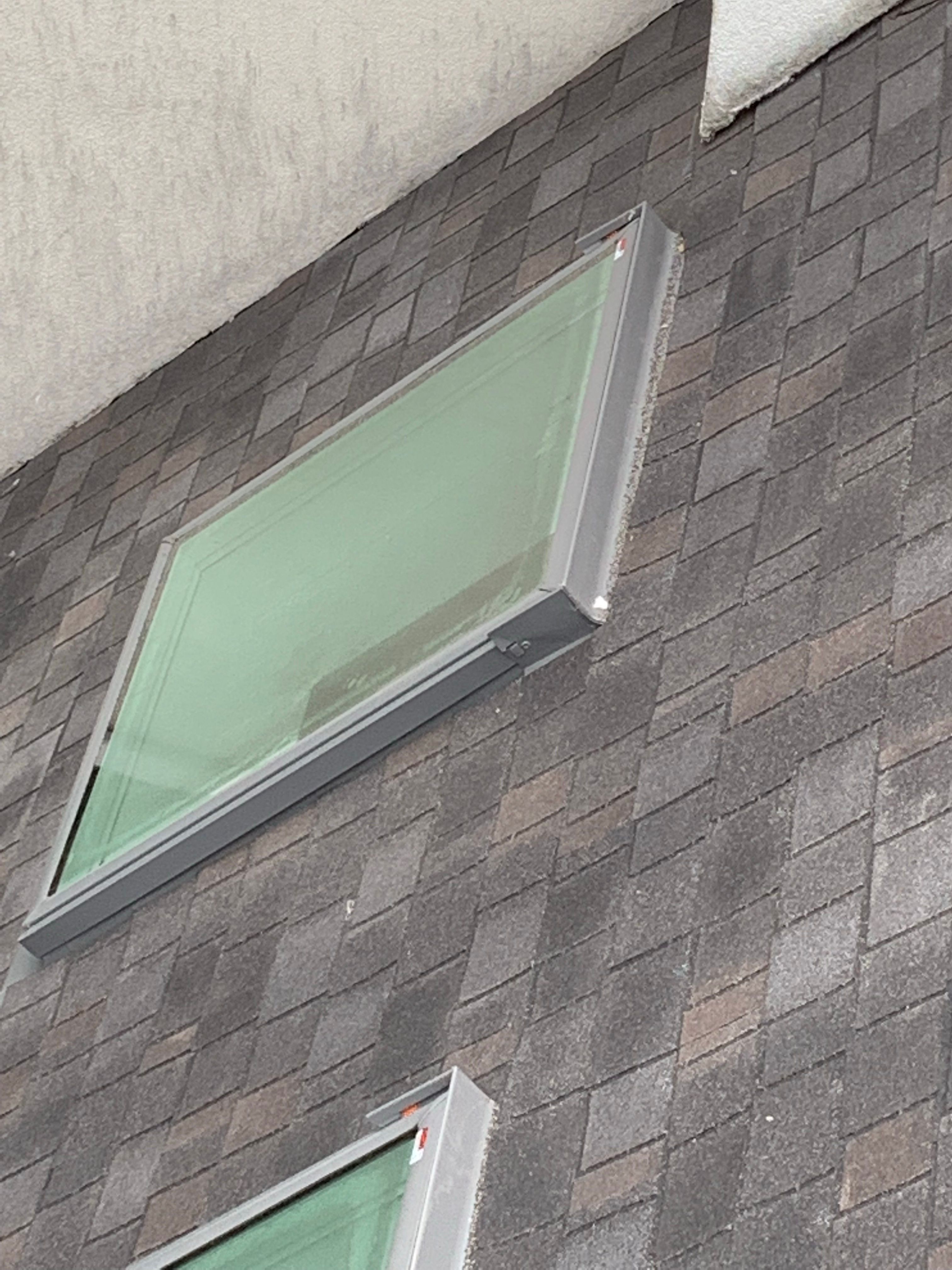 Skylight, Roof, and Gutter Replacement by American Home Contractors