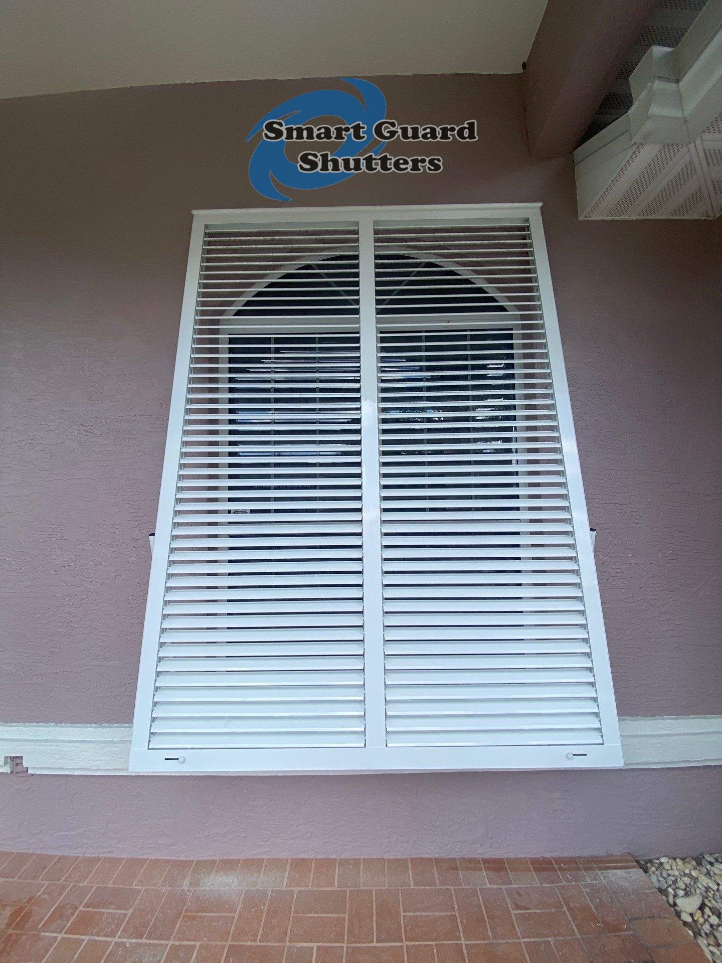 Impact Bahama Shutters in Signal White by Smart Guard Shutters