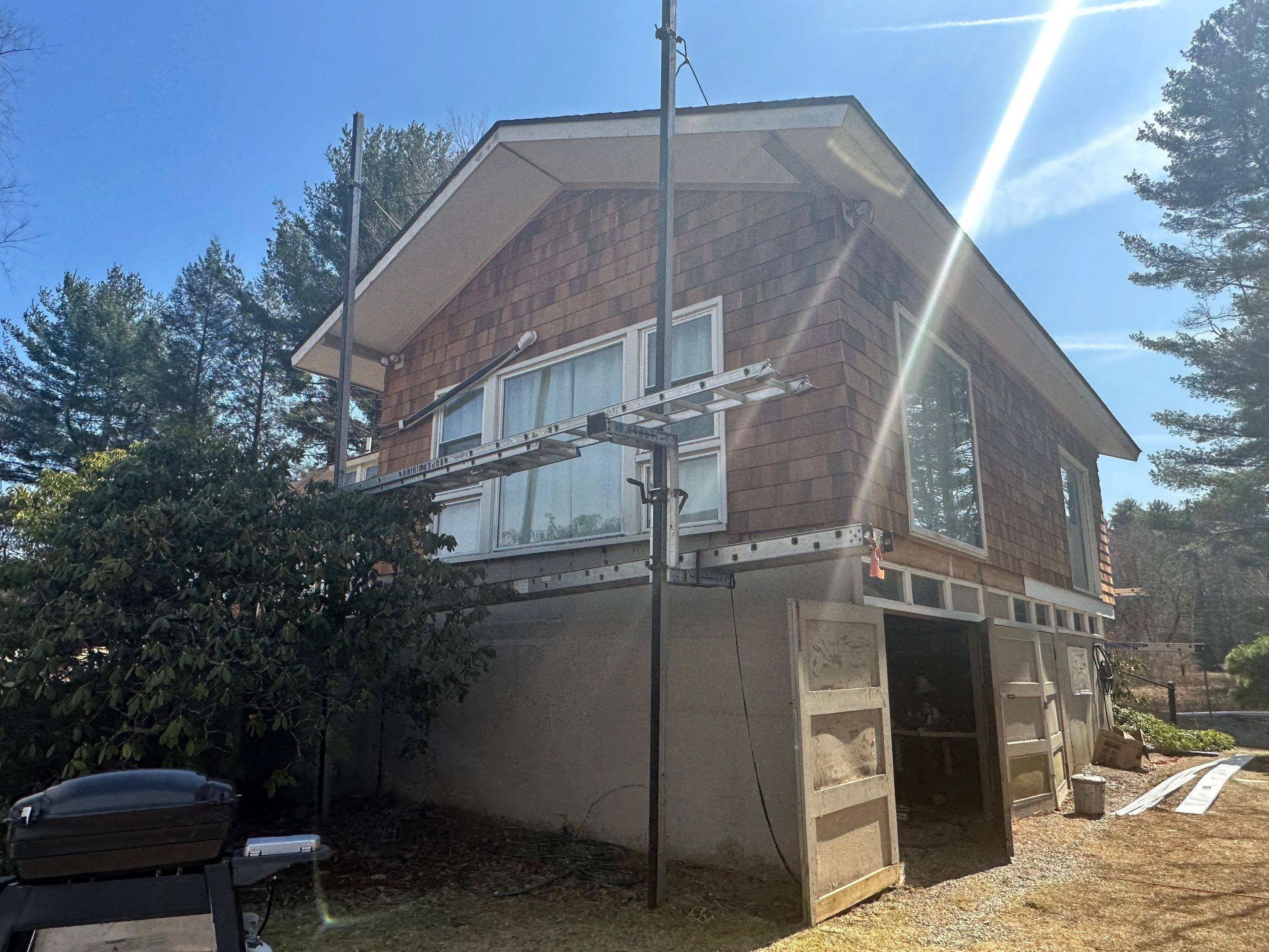 Siding Installation using Perfection Red Western Cedar Shingles  by Loyalty Exterior Solutions 