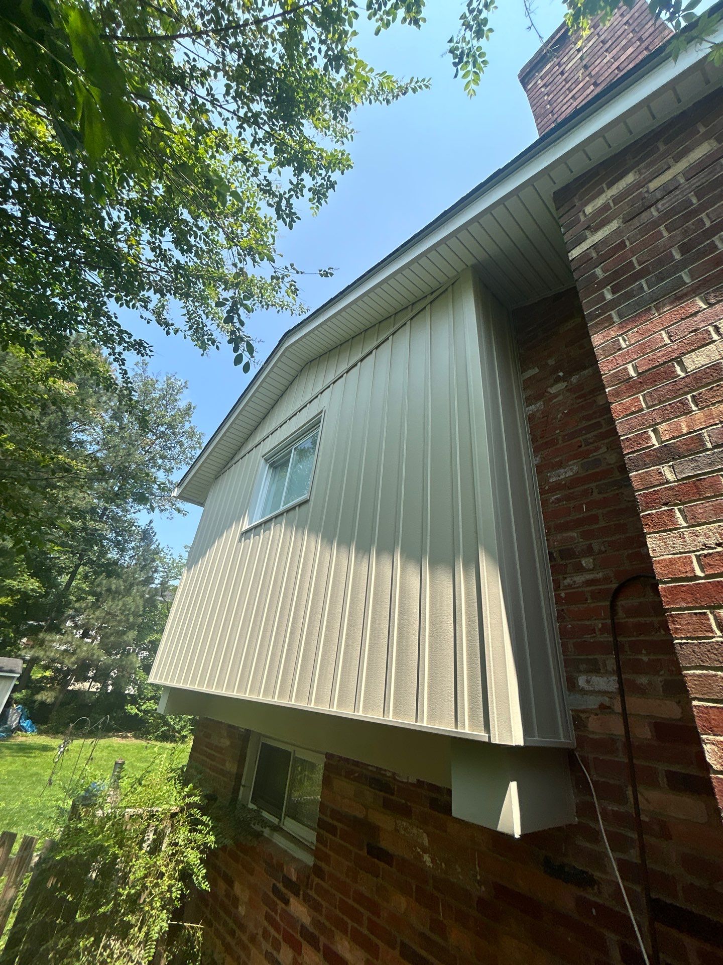 Fairfax: Residential Siding Replacement with CertainTeed 8" Board and Batten Siding in Desert Tan by RM Banning, Inc.