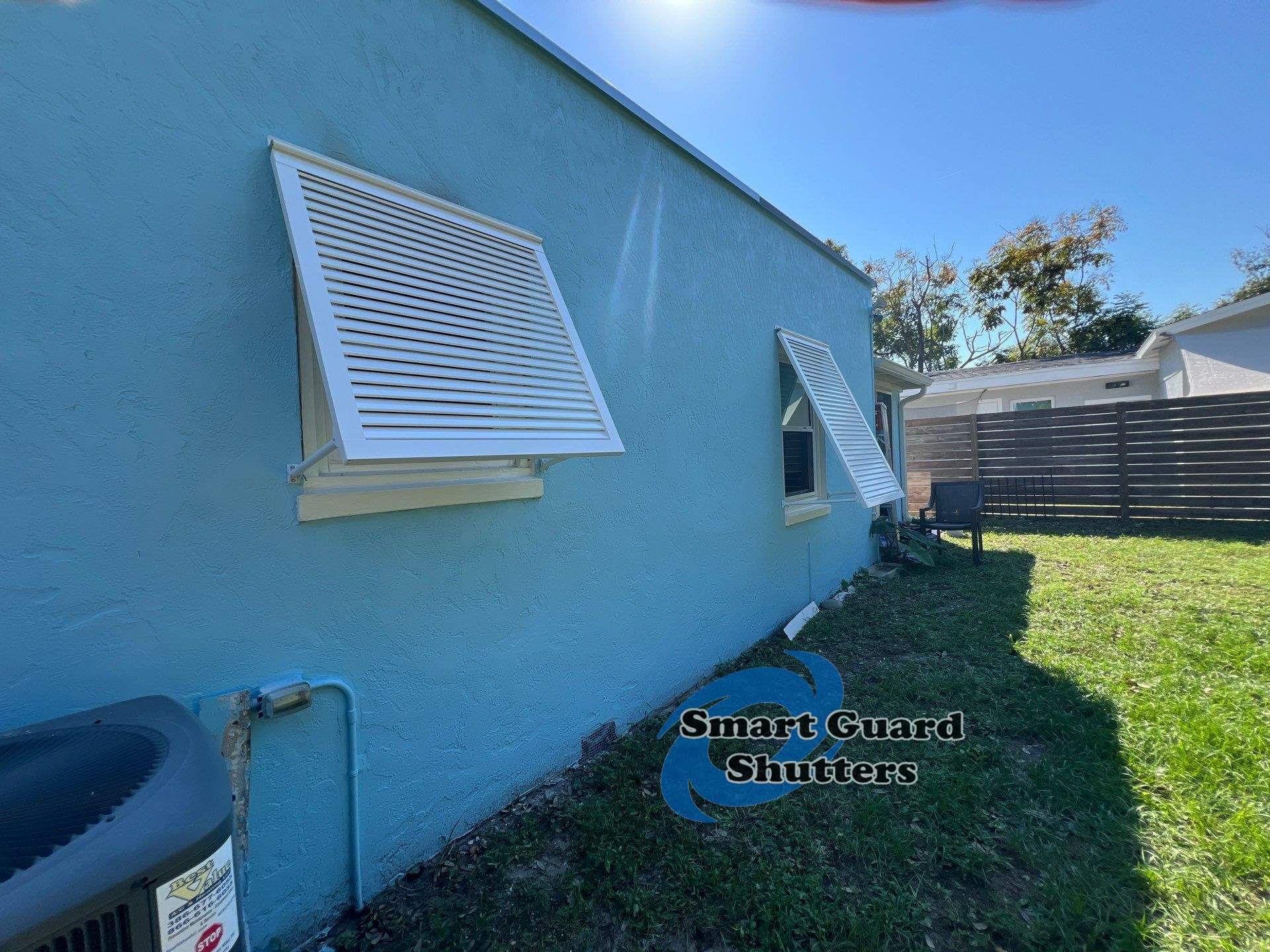 Decorative Bahama Shutters in Signal White  by Smart Guard Shutters