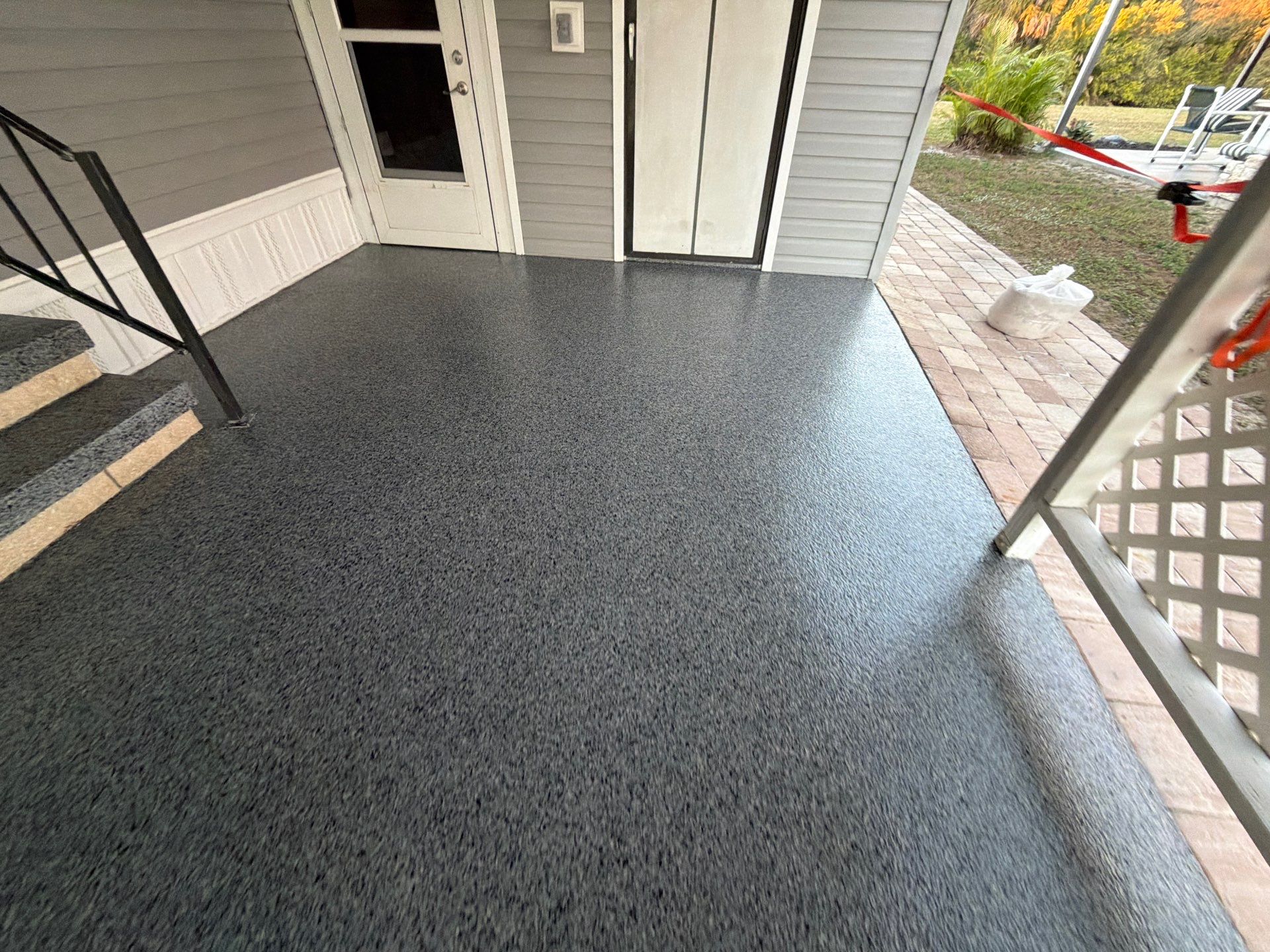 Driveway Transformation: Nightfall Flake System with Full UV & Moisture Protection by Performance Floors & Coating