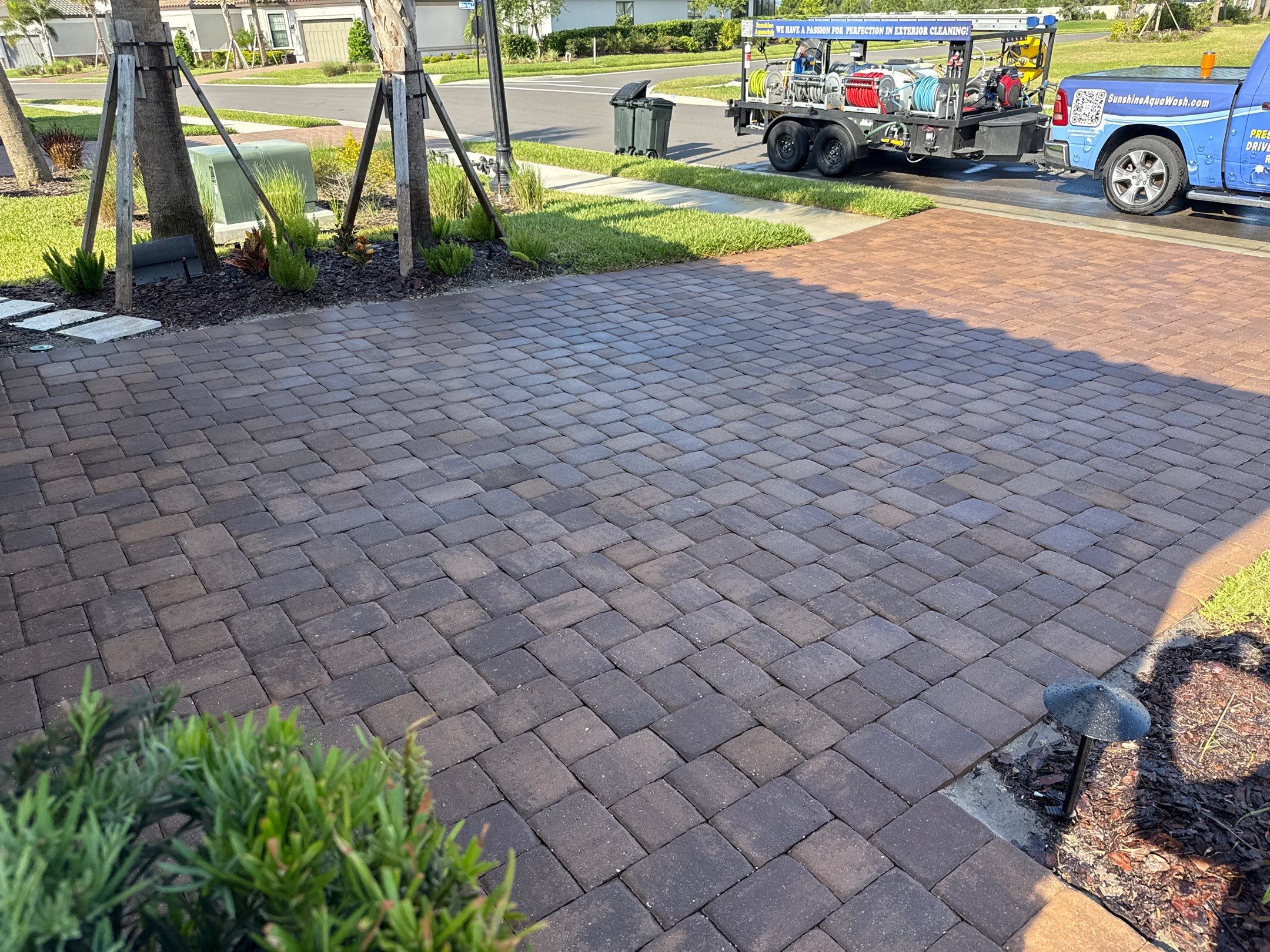 Oil Stain Removal on Paver Driveway | Esplanade at Artisan Lakes, Palmetto FL by Sunshine AquaWash