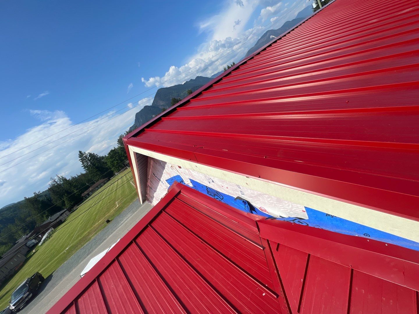 Commercial Roofing Installation using 12" Prolok metal  by Top Notch Roofing Inc