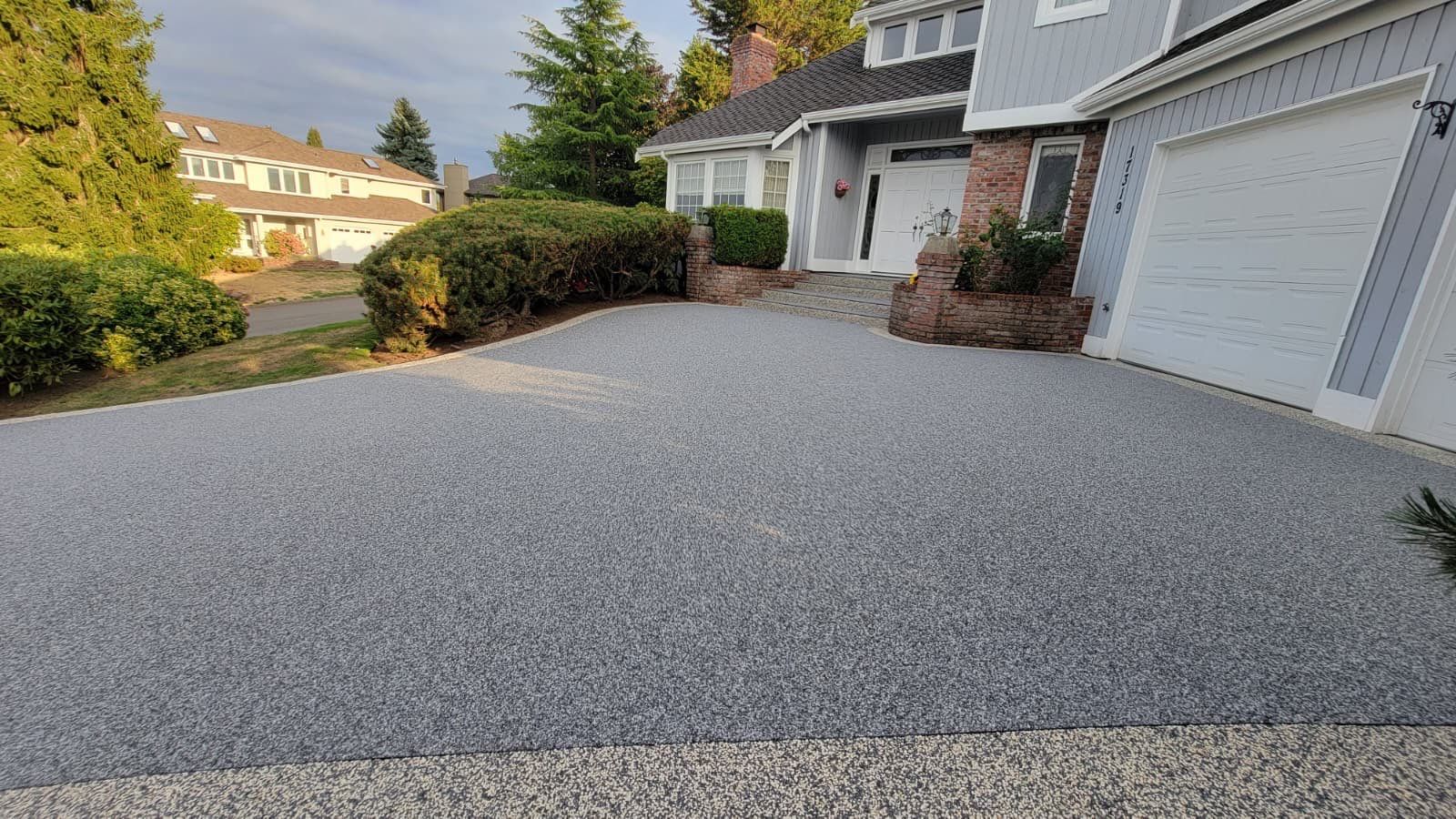 Elegant Driveway and Patio in Palazzo Vuba Stone by Concrete Coating Experts Inc.