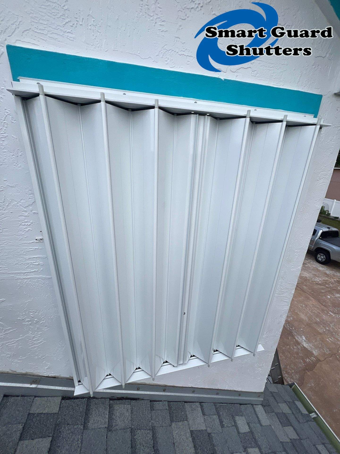 Accordion Shutters in White by Smart Guard Shutters