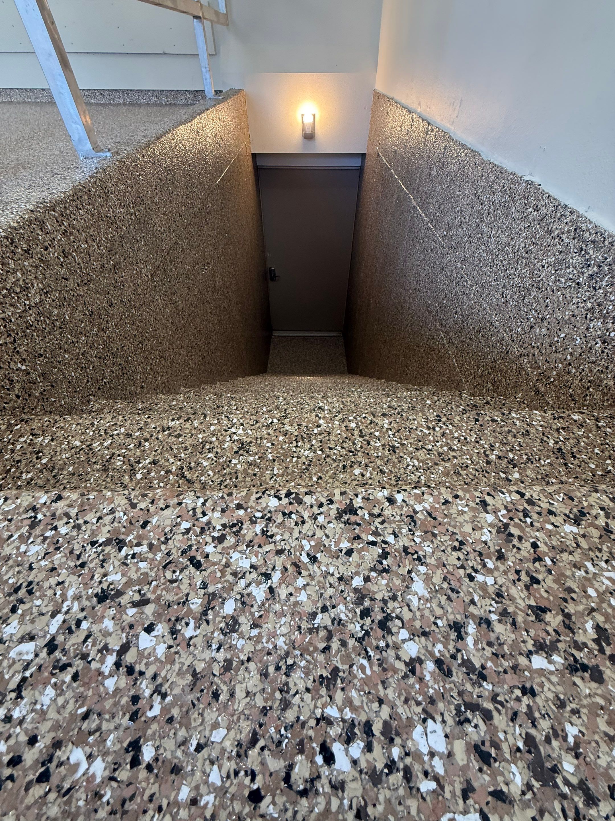 Custom Polyaspartic Garage Floor and Stairwell Coating in Pipestone by Select Painting, Coatings & Garage Cabinets