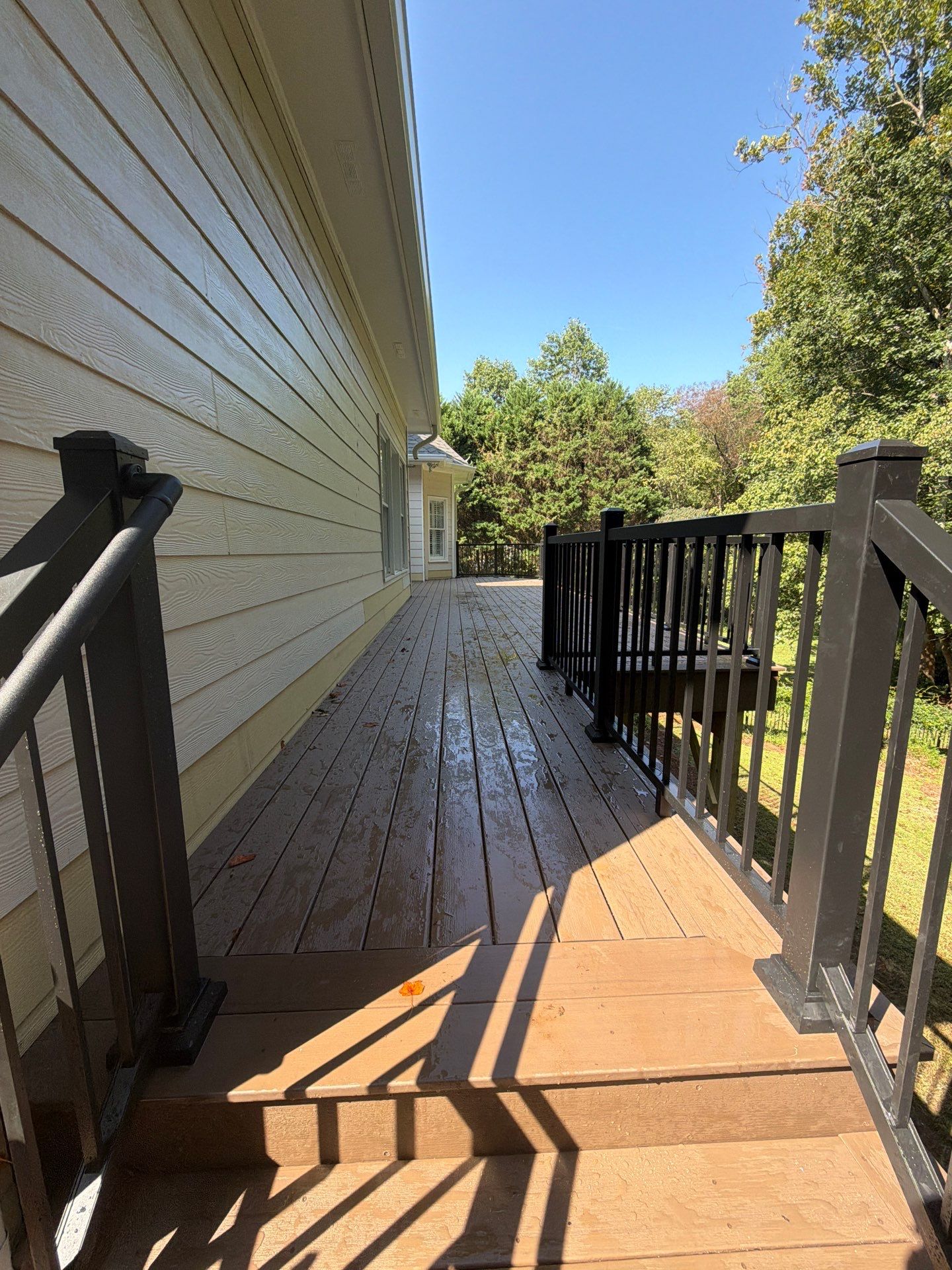 Elevated Composite Deck Replacement with Metal Railings in Smyrna by Swift Home Renovations 
