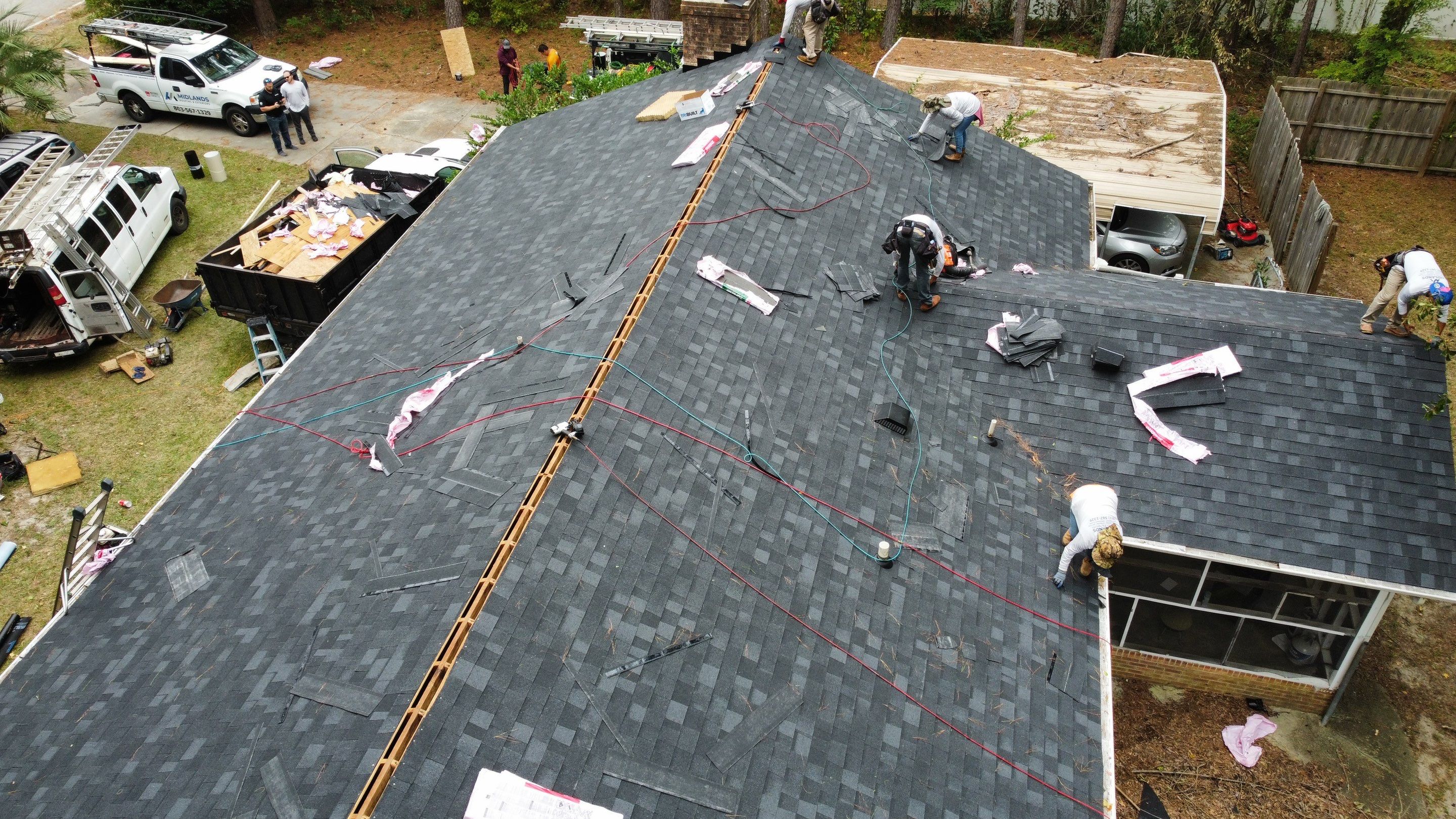 New Onyx Black Shingle Roof Replacement and Tree Damage Repair. by Midlands Roofing & Exteriors