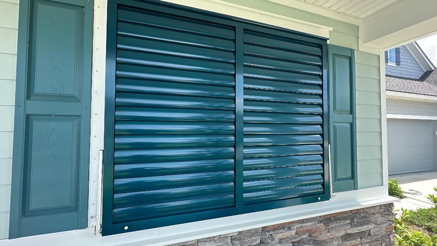 Hurricane Rated Bahama Shutters in Ocean Blue by Smart Guard Shutters