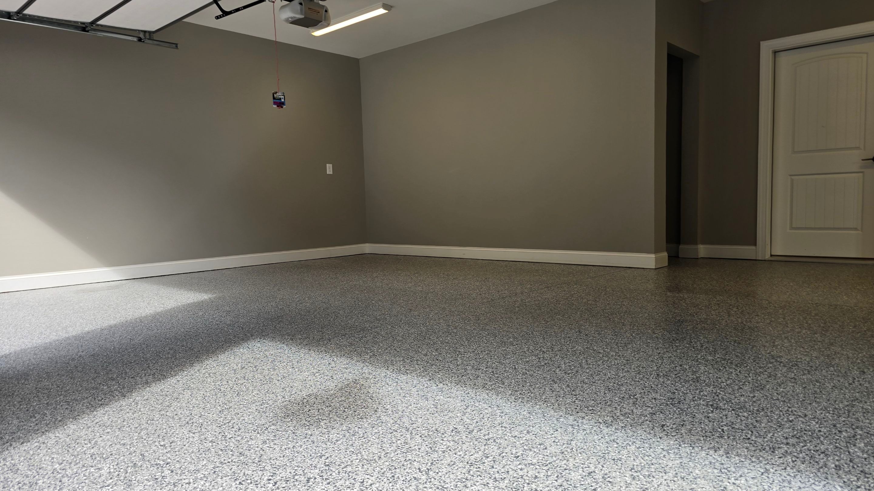 Patio Using Basalt & Garage Using Gravel by Elite Floor Solutions