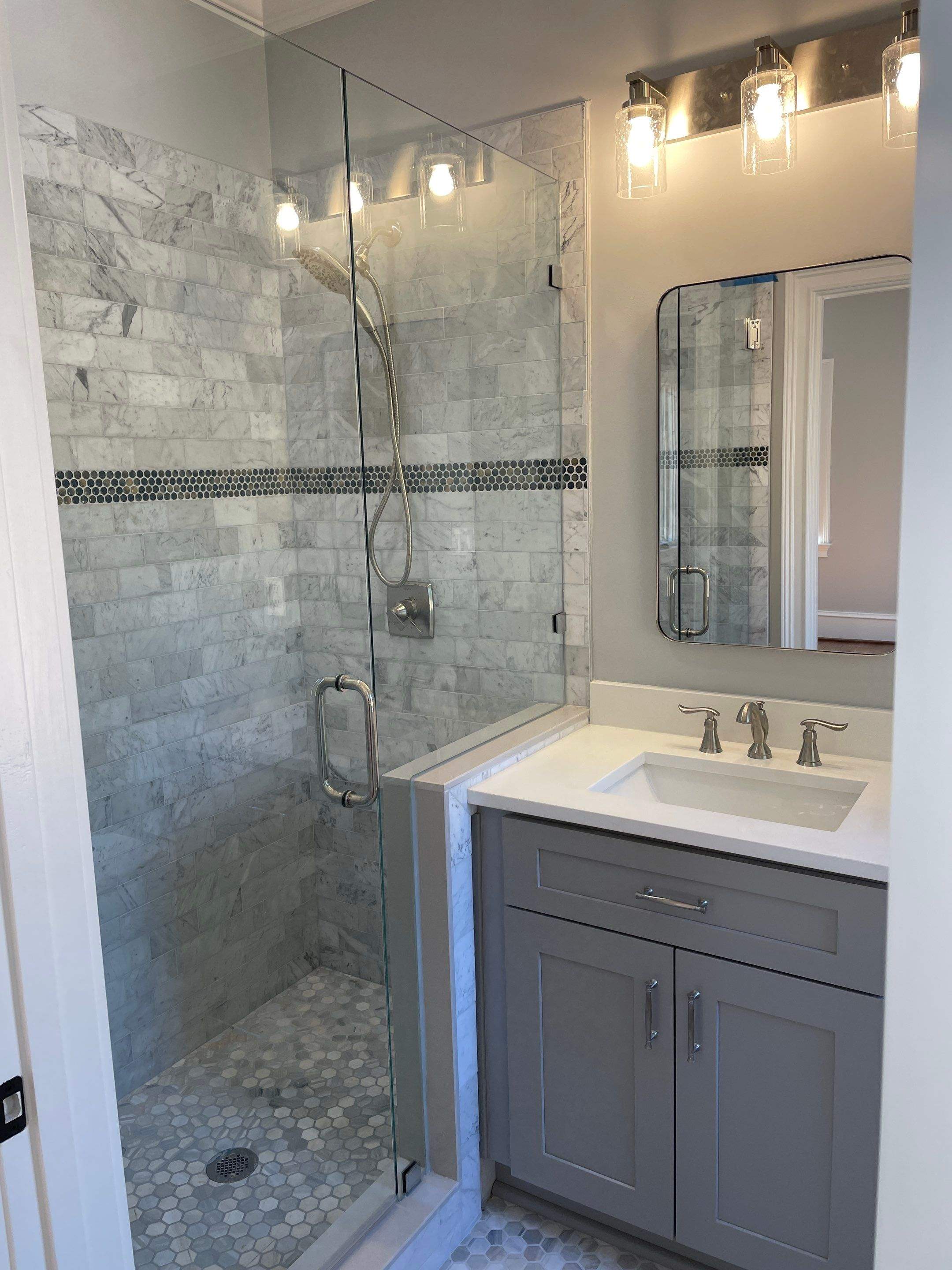 Classic Marble Tile shower by Footprints Bath and Tile of East Atlanta