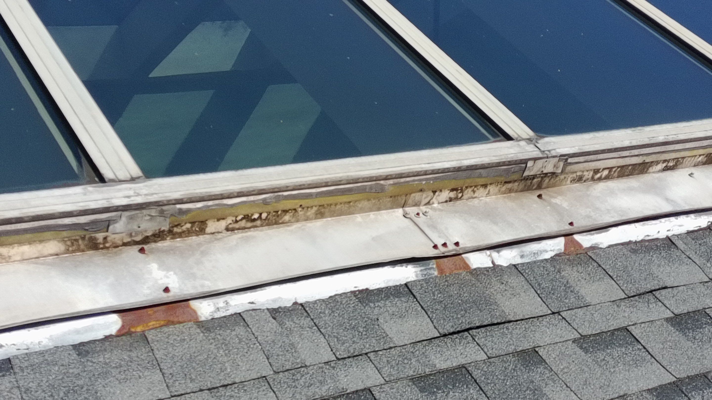 Ridge Skylight Repair and Shingle Roof Maintenance in Winter Park by Fortified Roofing Solutions Corp.
