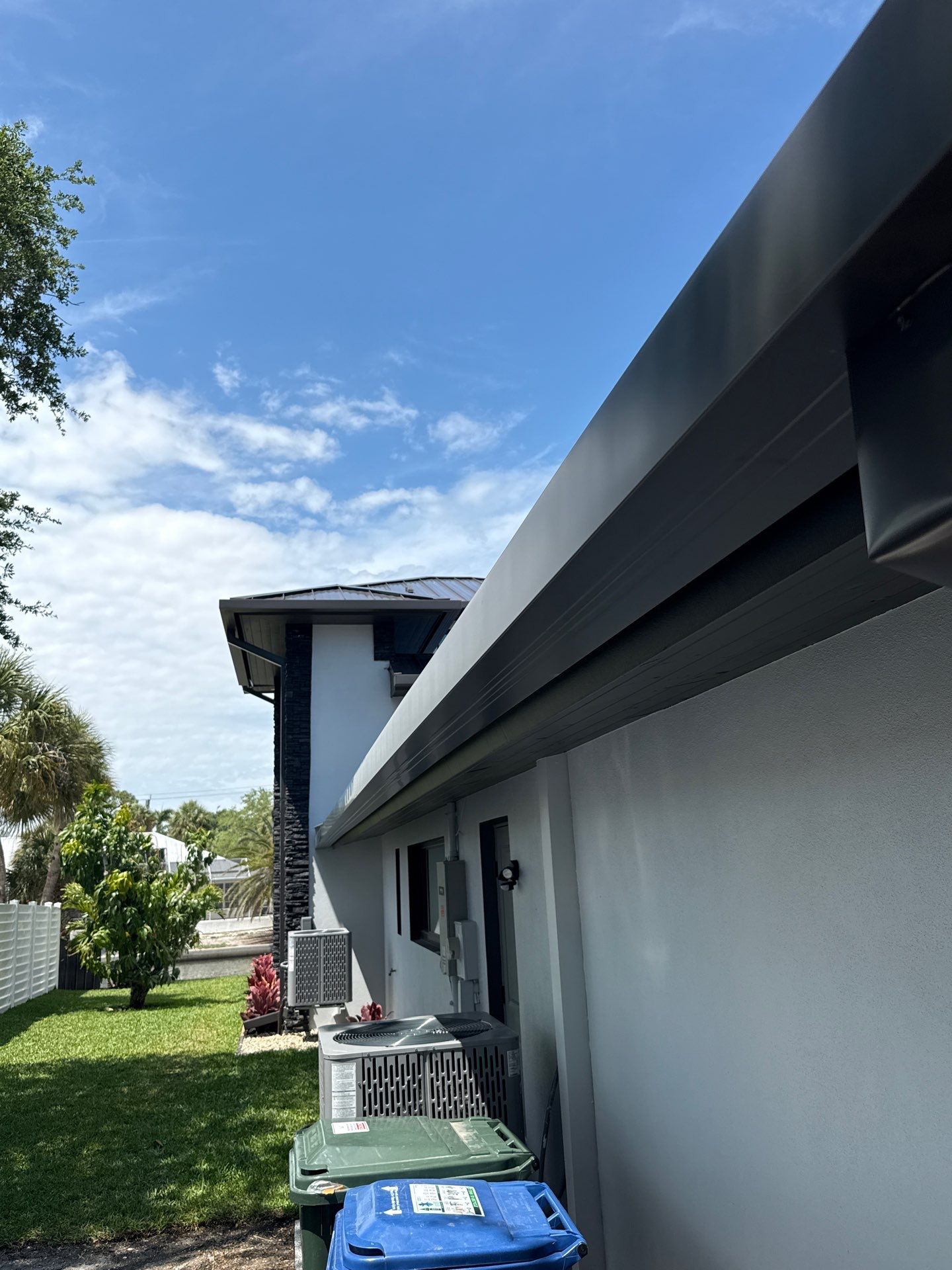 7-Inch Smooth Box Seamless Gutters using black seamless gutters in Siesta Key Fl by Gutter Professors