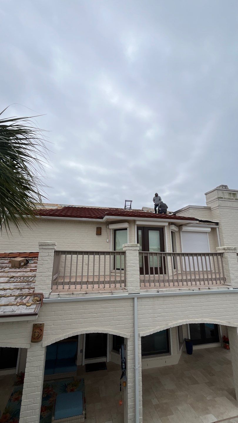 Off with the Tile and on with the TILCOR stone coated metal.  by Bayfront Roofing and Construction