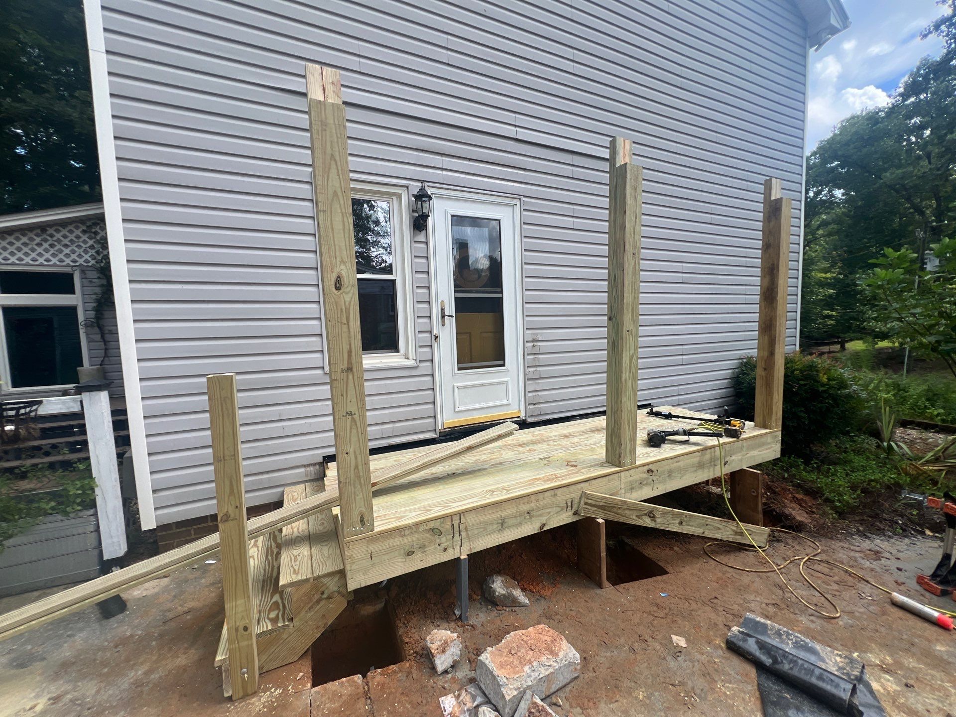 Custom Pressure-Treated Deck and Metal Roof Installation in Durham by The Remodeling Company