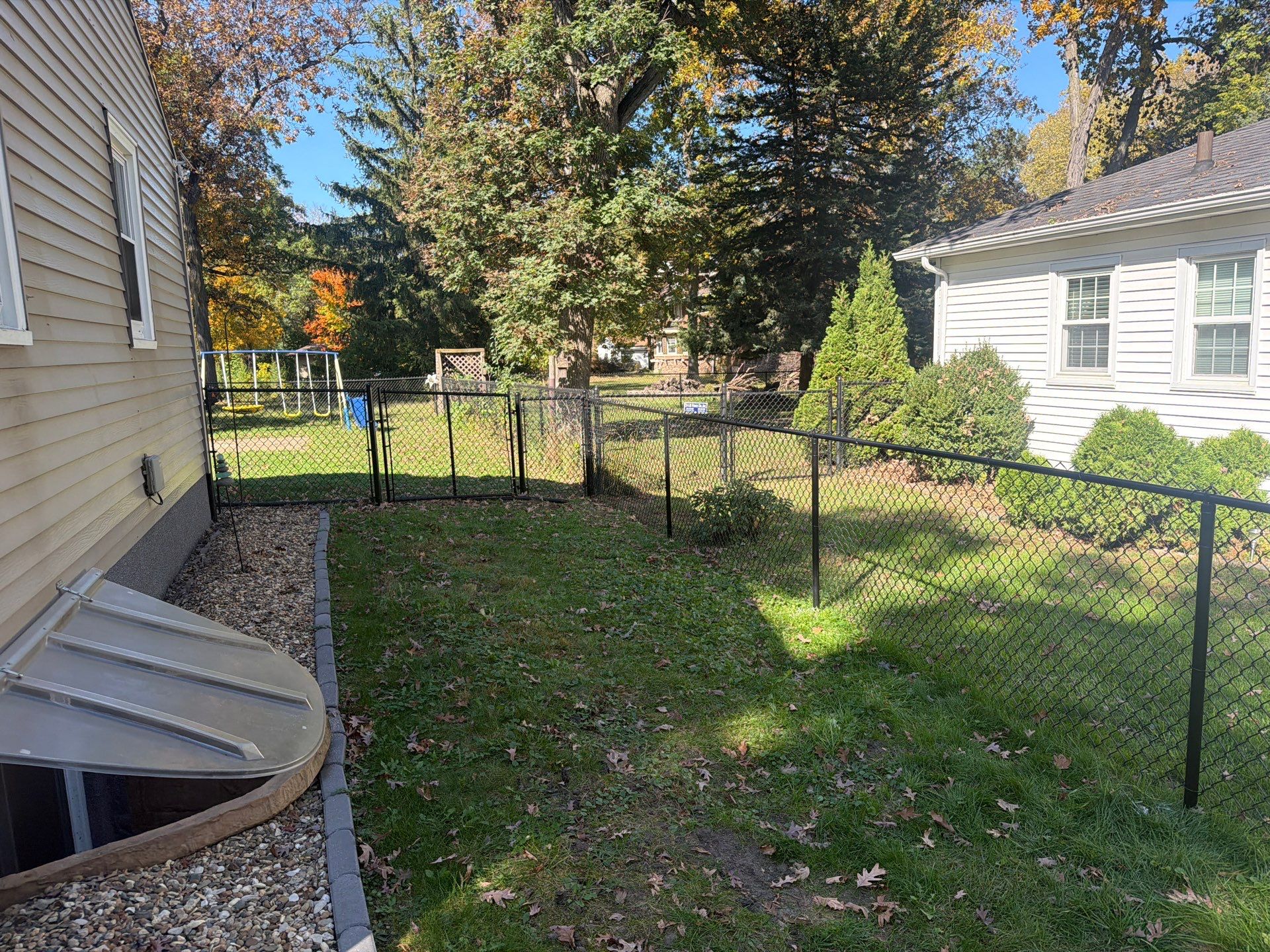 Residential Black Chain Link Fencing in Cedar Falls by Perfect Picket Fence and Stain
