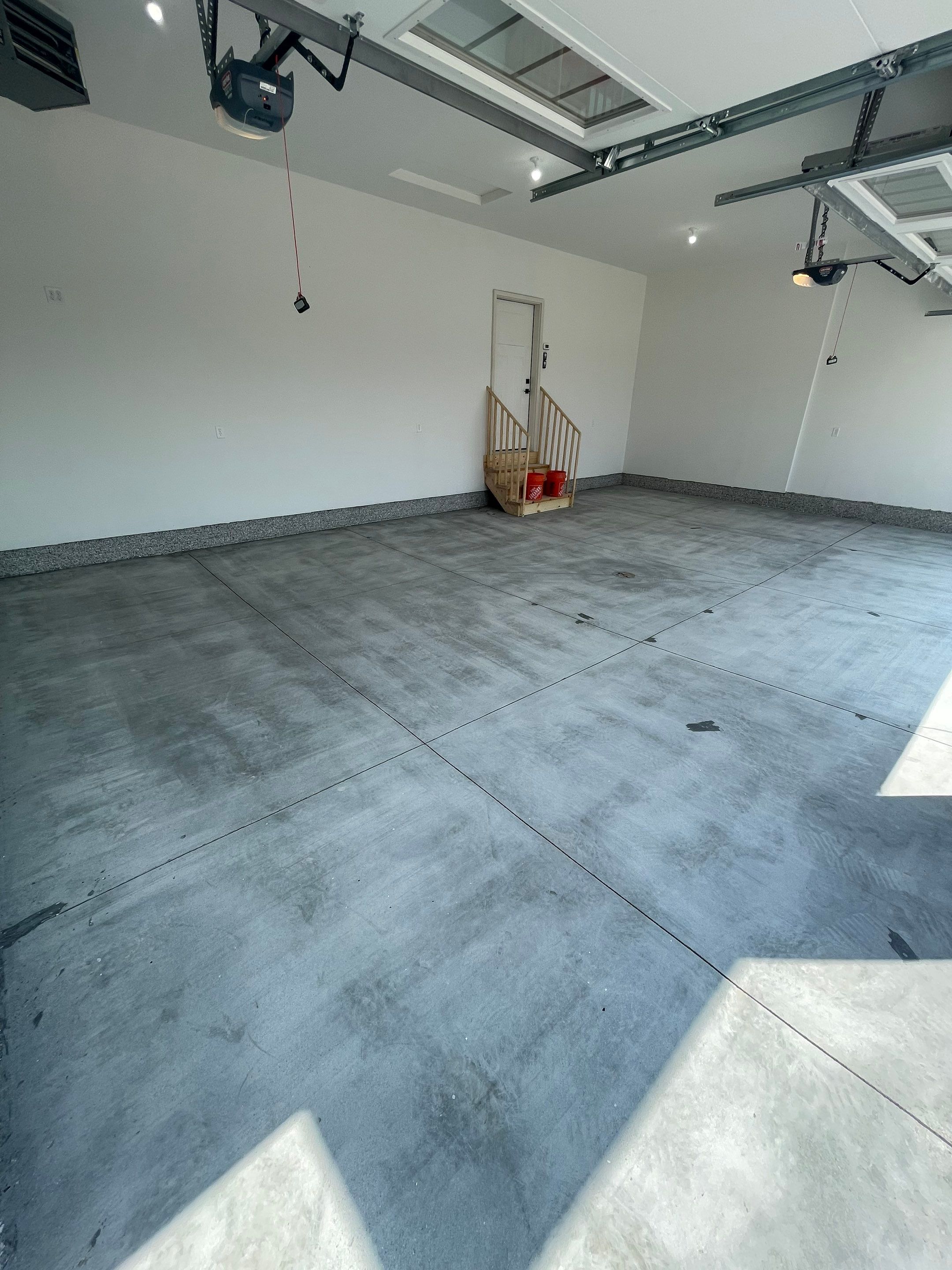 Grey Speckled Garage Floor Coating in Sioux Falls by Select Painting, Coatings & Garage Cabinets