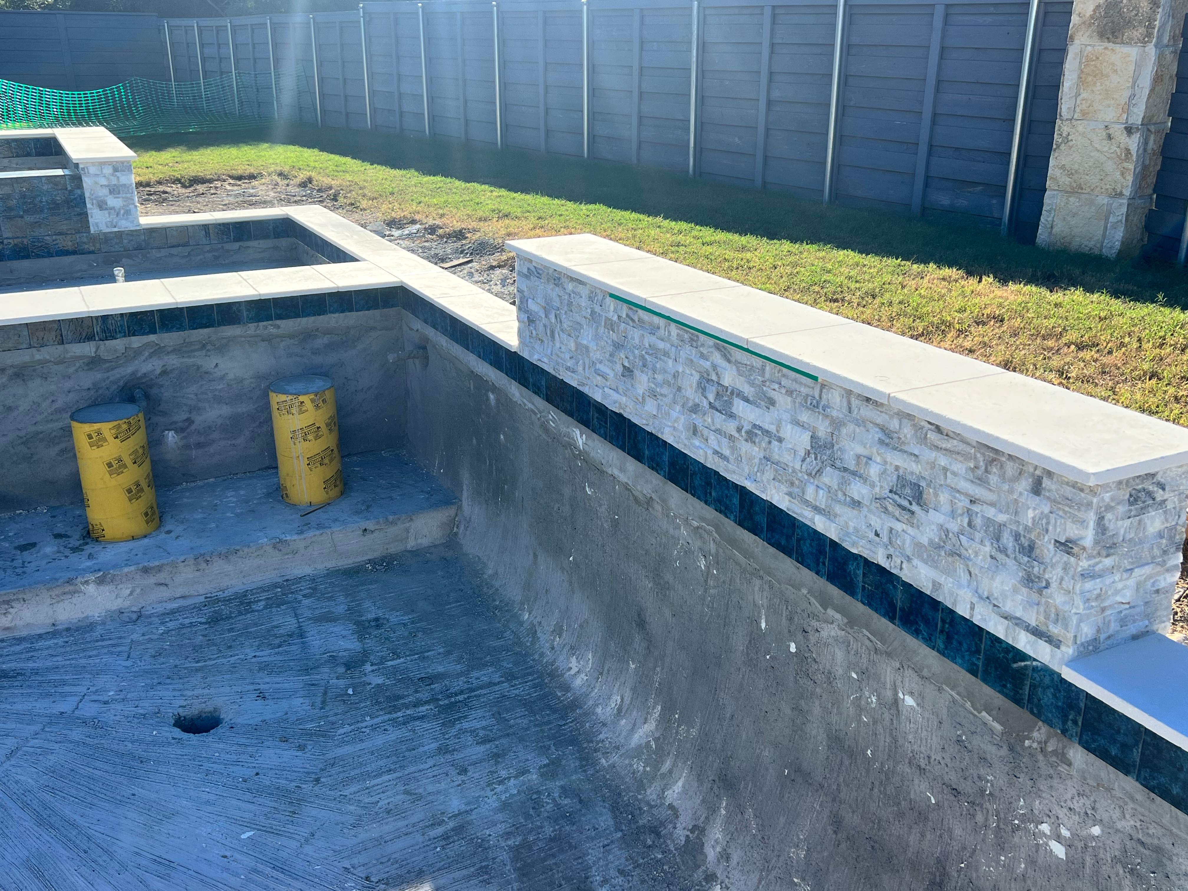 Geometric Pool with Raised Spa and Tanning Ledge by Pinnacle Pools and Spas - DFW