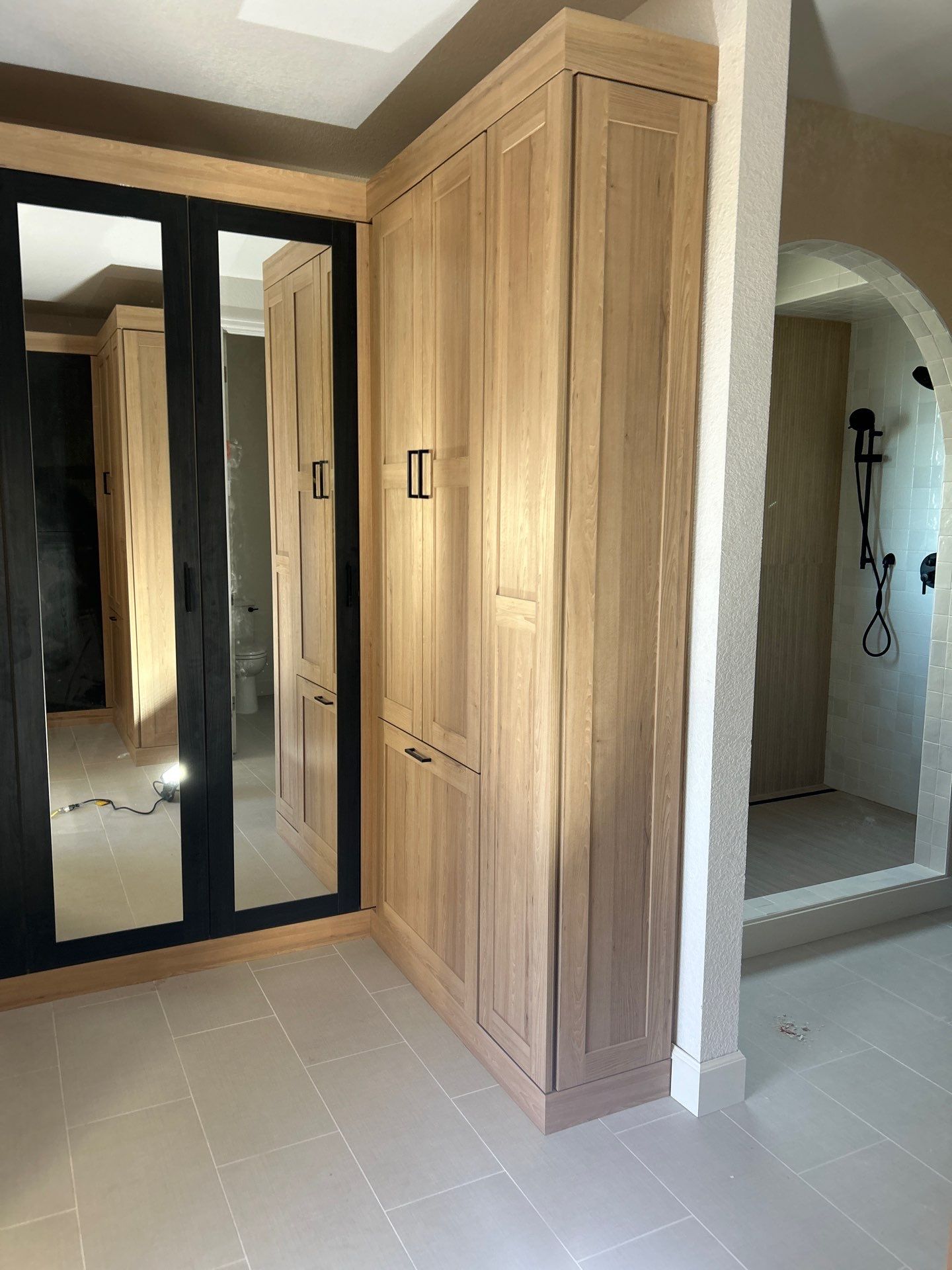 Two-Tone Closet with matching Mudroom + Laundry Room by Concept 32, Inc.