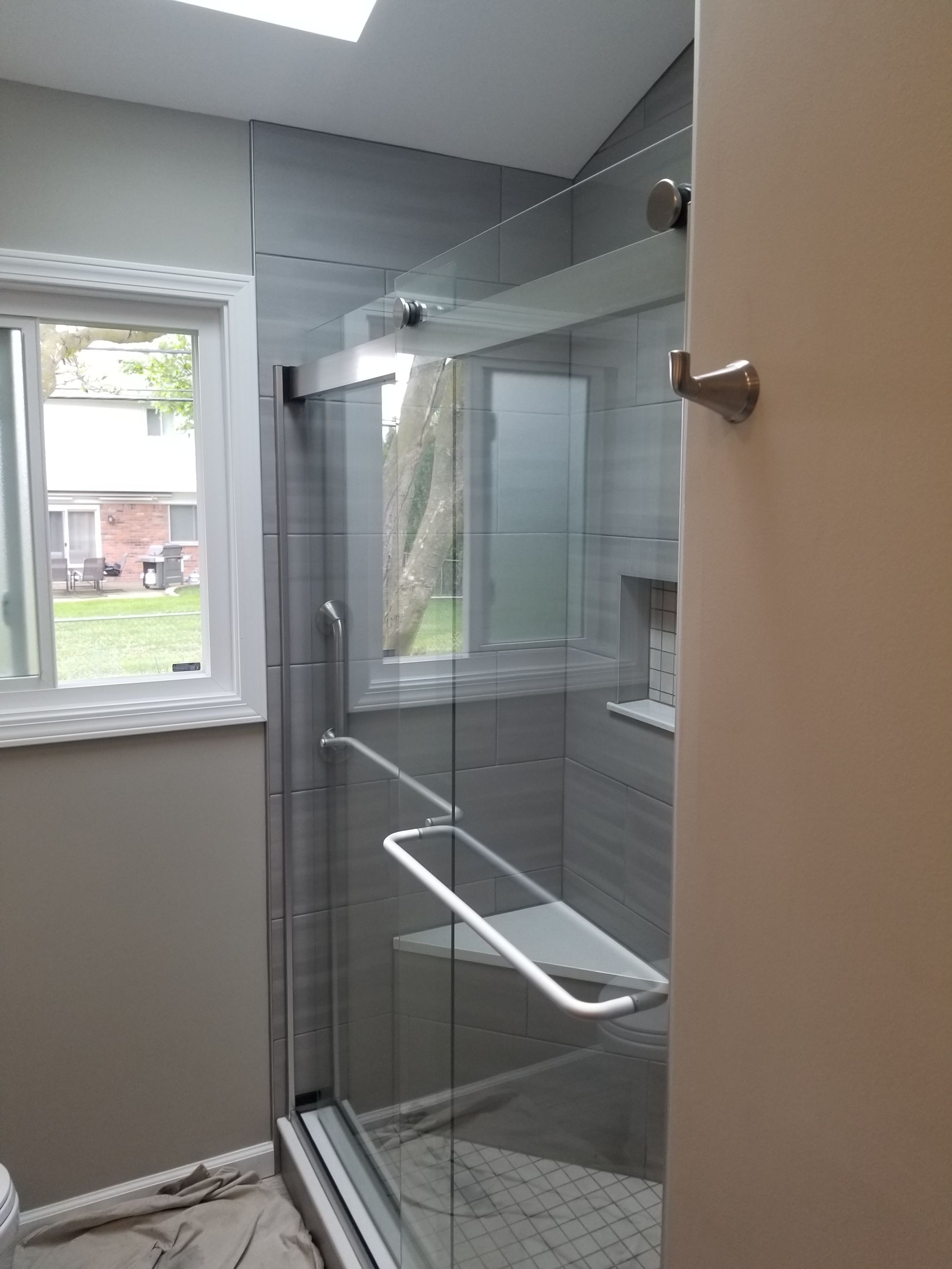 Remodel full bathroom new tile walk in shower plus 2nd half bath Powder room in Livonia, MI by Northwest Construction