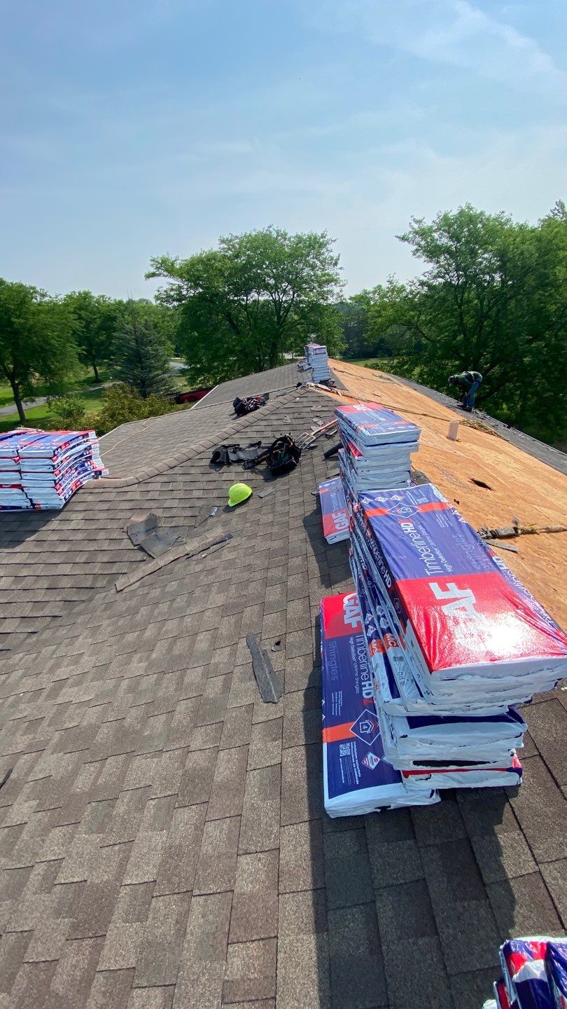 Asphalt Roof Replacement and Aluminum Gutter Installation by Custom Installations