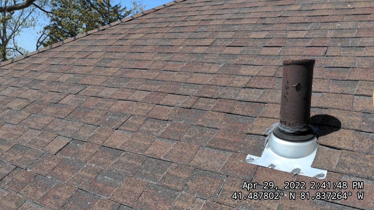 Residential Roofing Installation, Dec-tek walk-out porch roof, siding on garage by Absolute Roofing and Construction