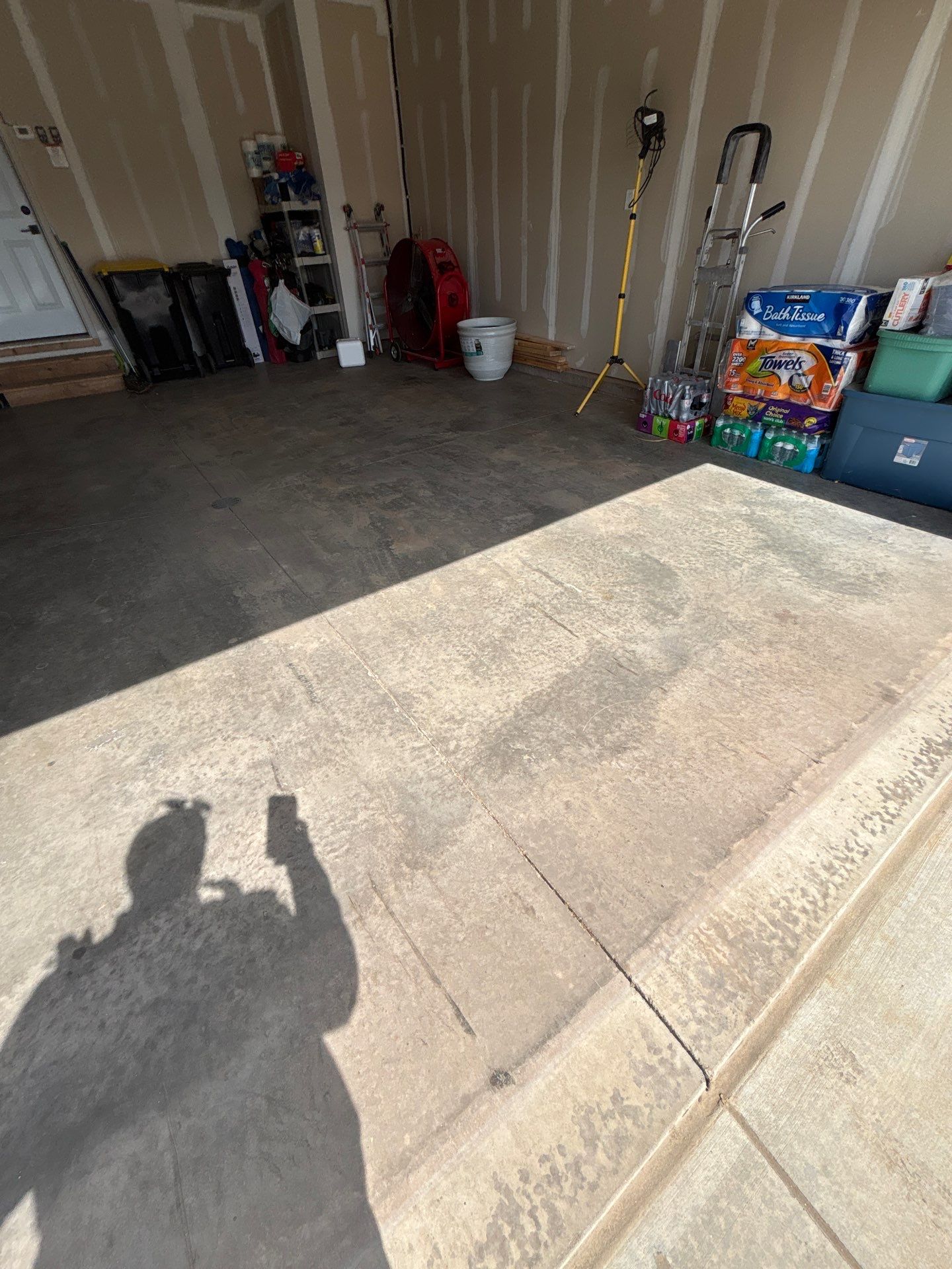 Grey Flake Epoxy Garage Floor Coating in Sioux Falls by Select Painting, Coatings & Garage Cabinets