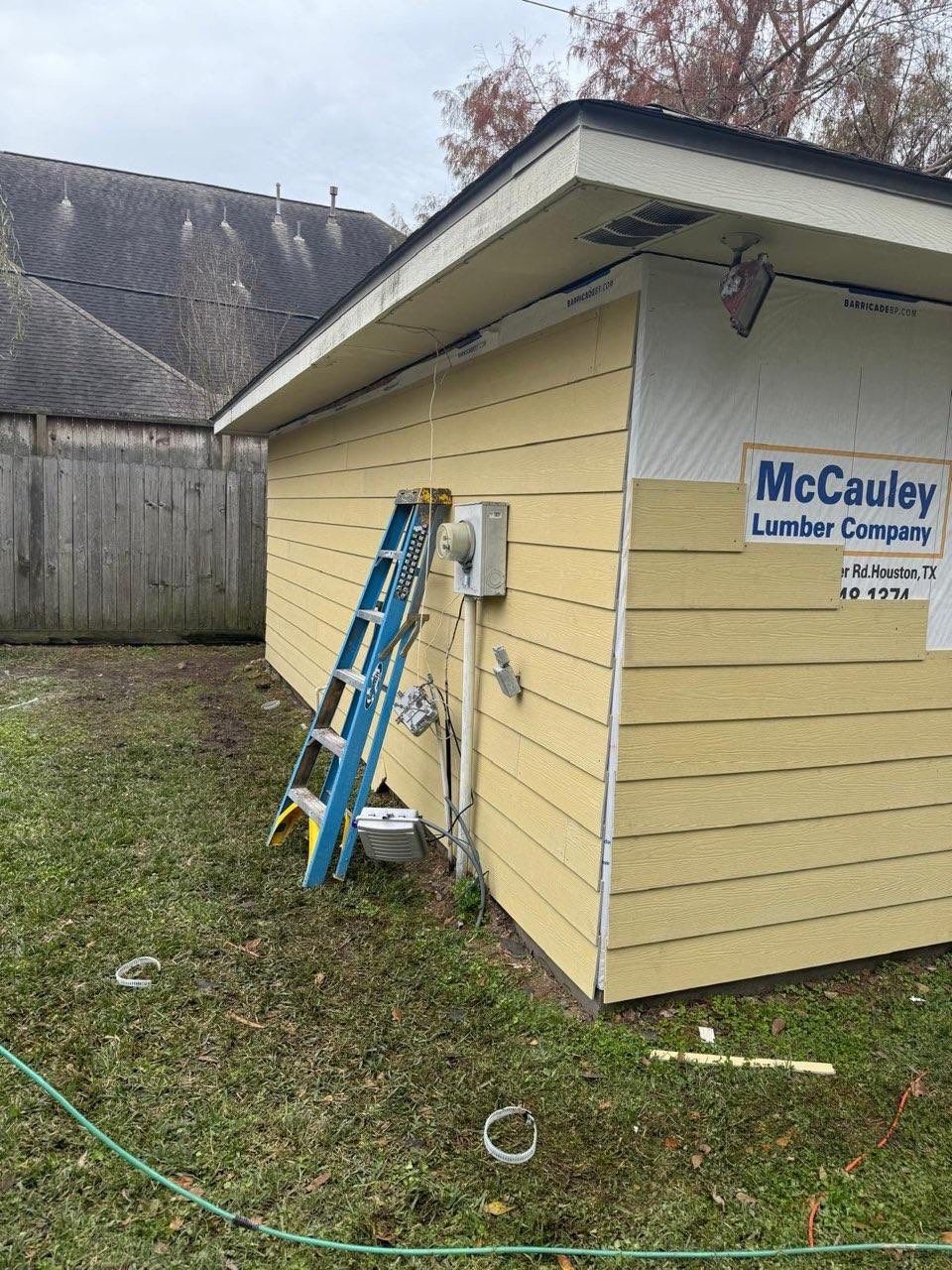 Garage Siding Replacement by Houston Roofing & Construction