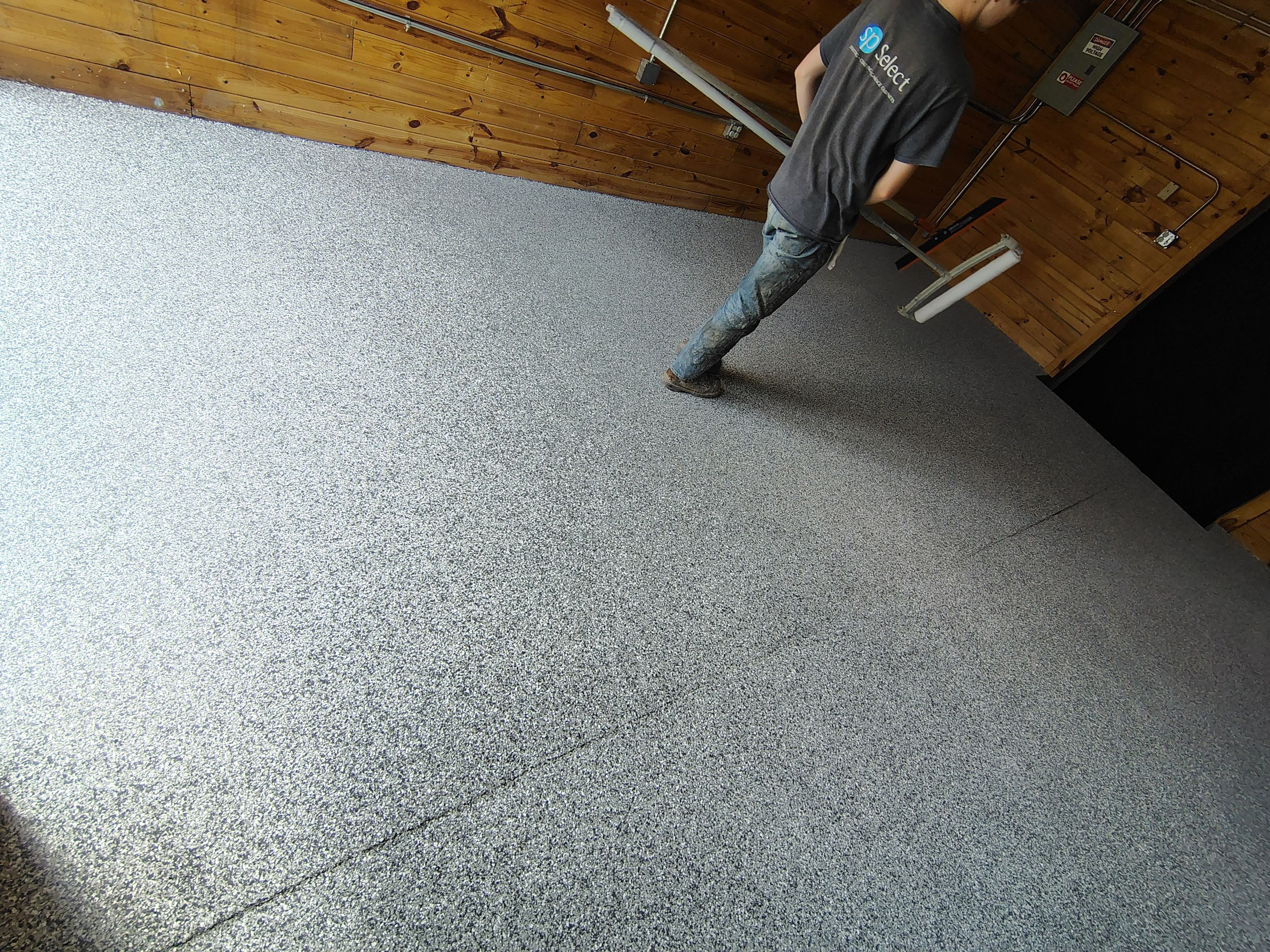 Commercial Epoxy Flake Floor Coating in Emmetsburg, Iowa by Select Painting, Coatings & Garage Cabinets