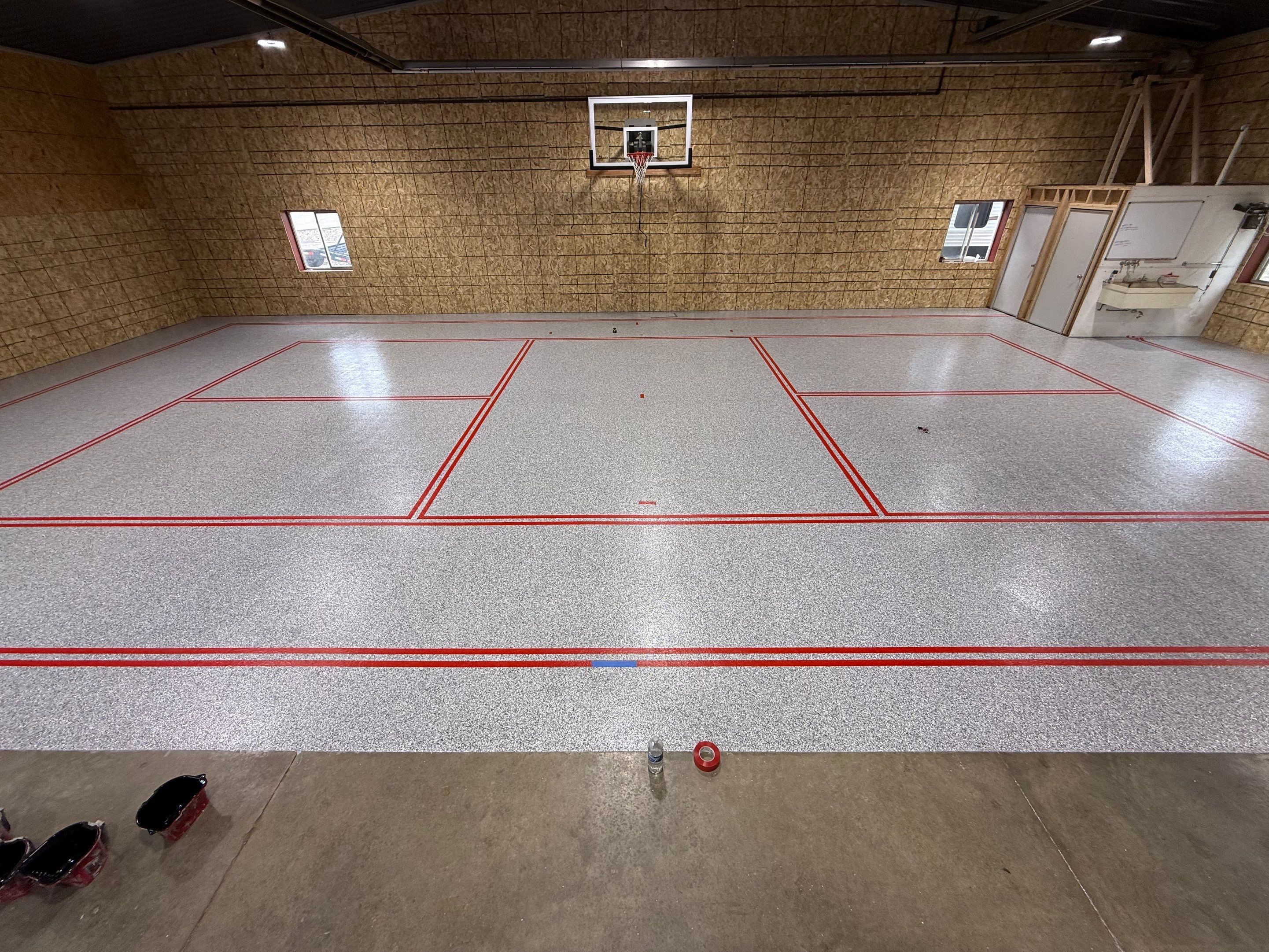 Custom Polyurea Shop Floor with Basketball Court Lines in Rock Valley by Select Painting, Coatings & Garage Cabinets