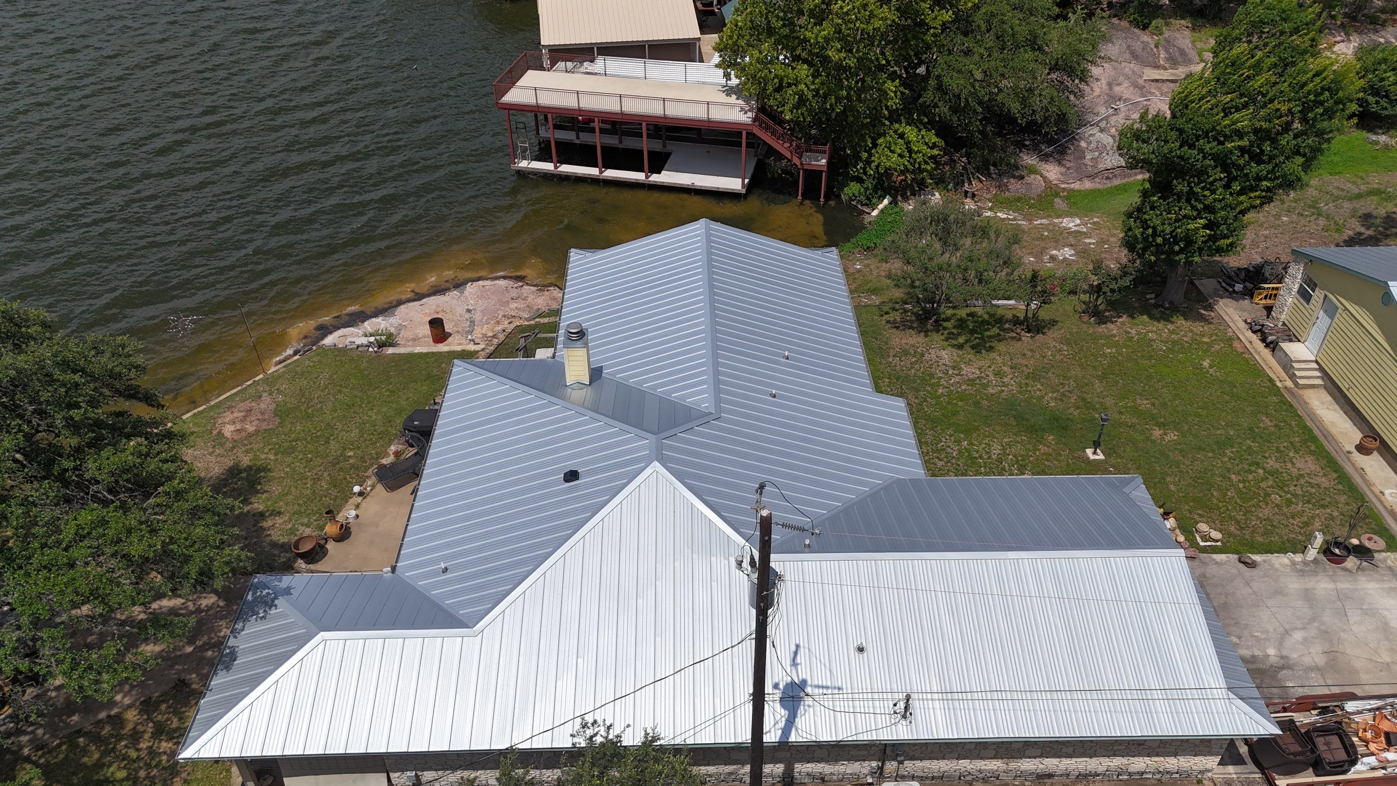 Residential Roof Replacement using 24 GA Snap-Loc - Galvalume by Action Exteriors Austin