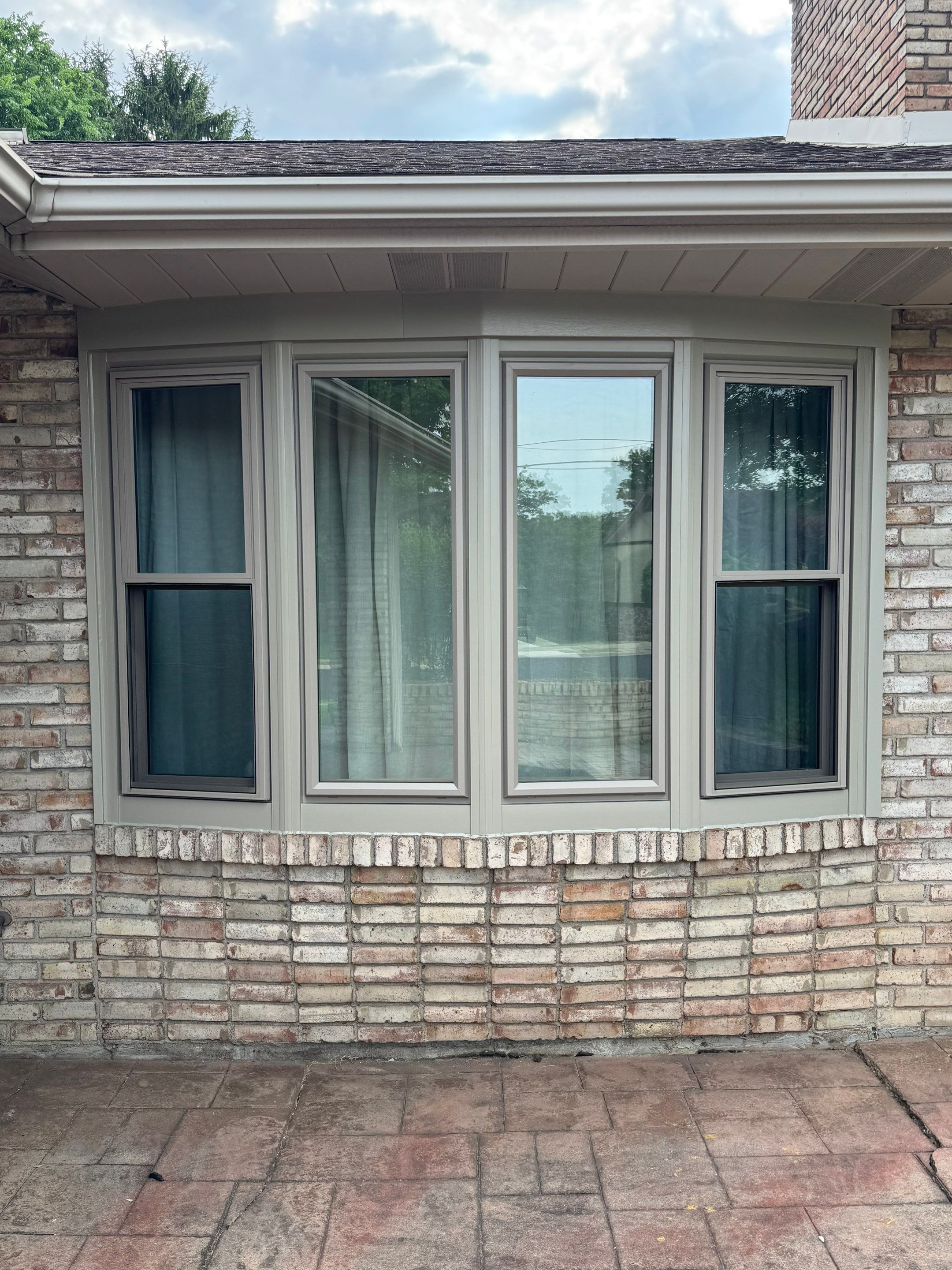 Four-Panel Bay Window Installation with Beige Trim in Weirton by Ohio State Windows