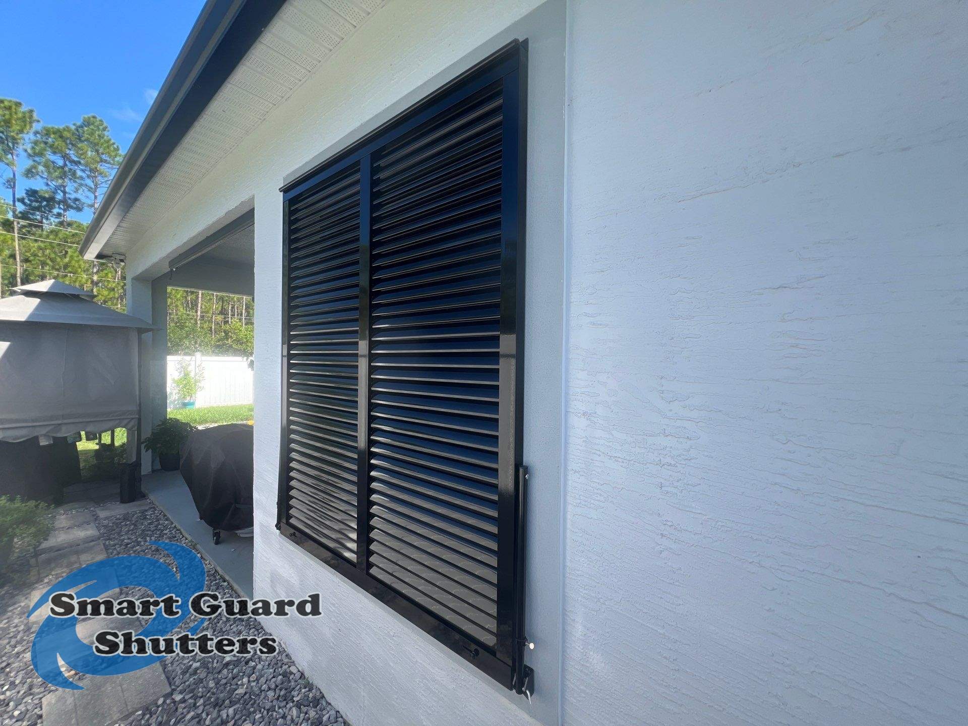 Impact Bahama Shutters in Jet Black by Smart Guard Shutters