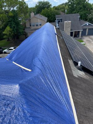 Placement of tarps on the roof. using TARP BLUE