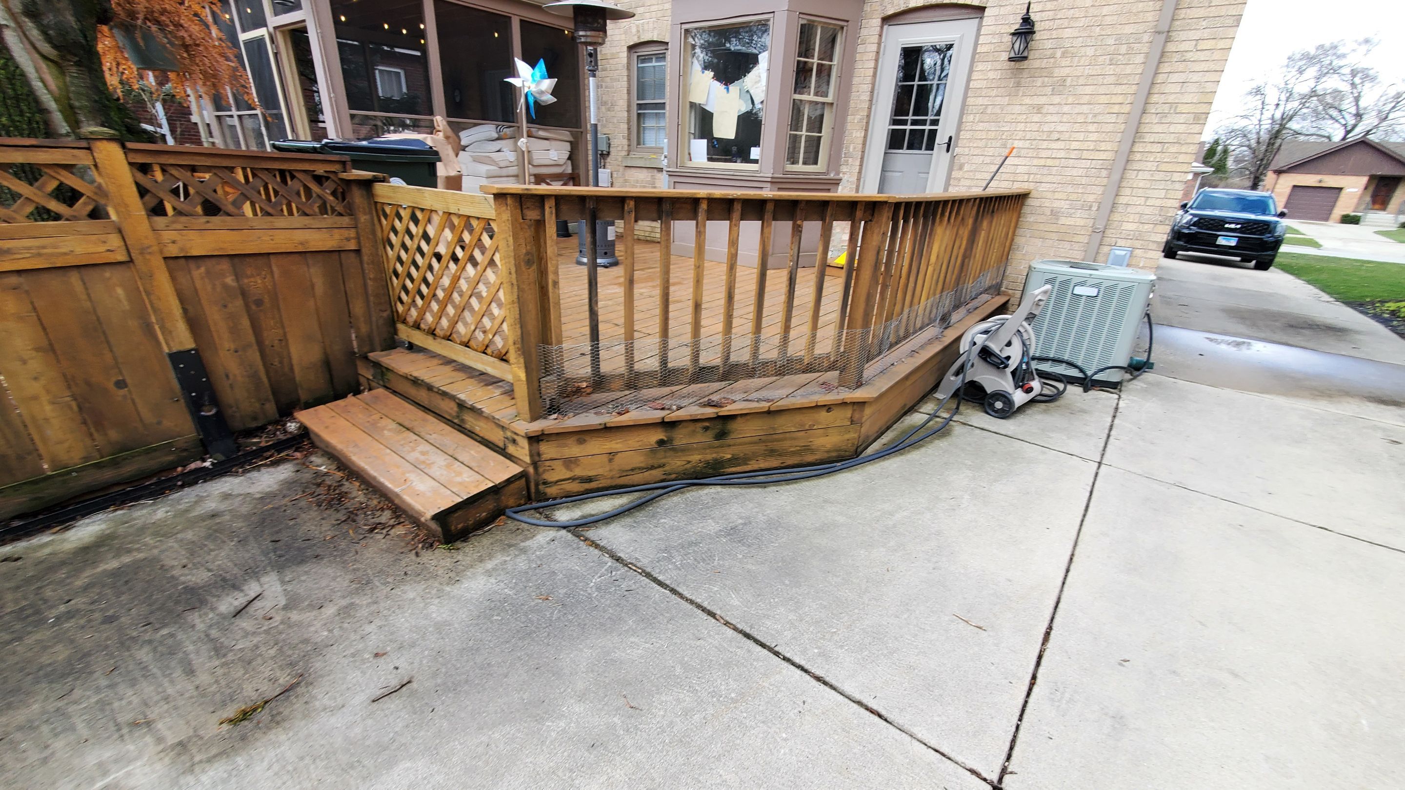 Wood cleaning and staining using Armstrong cloark oil stain by Northern Power Washing LLC.