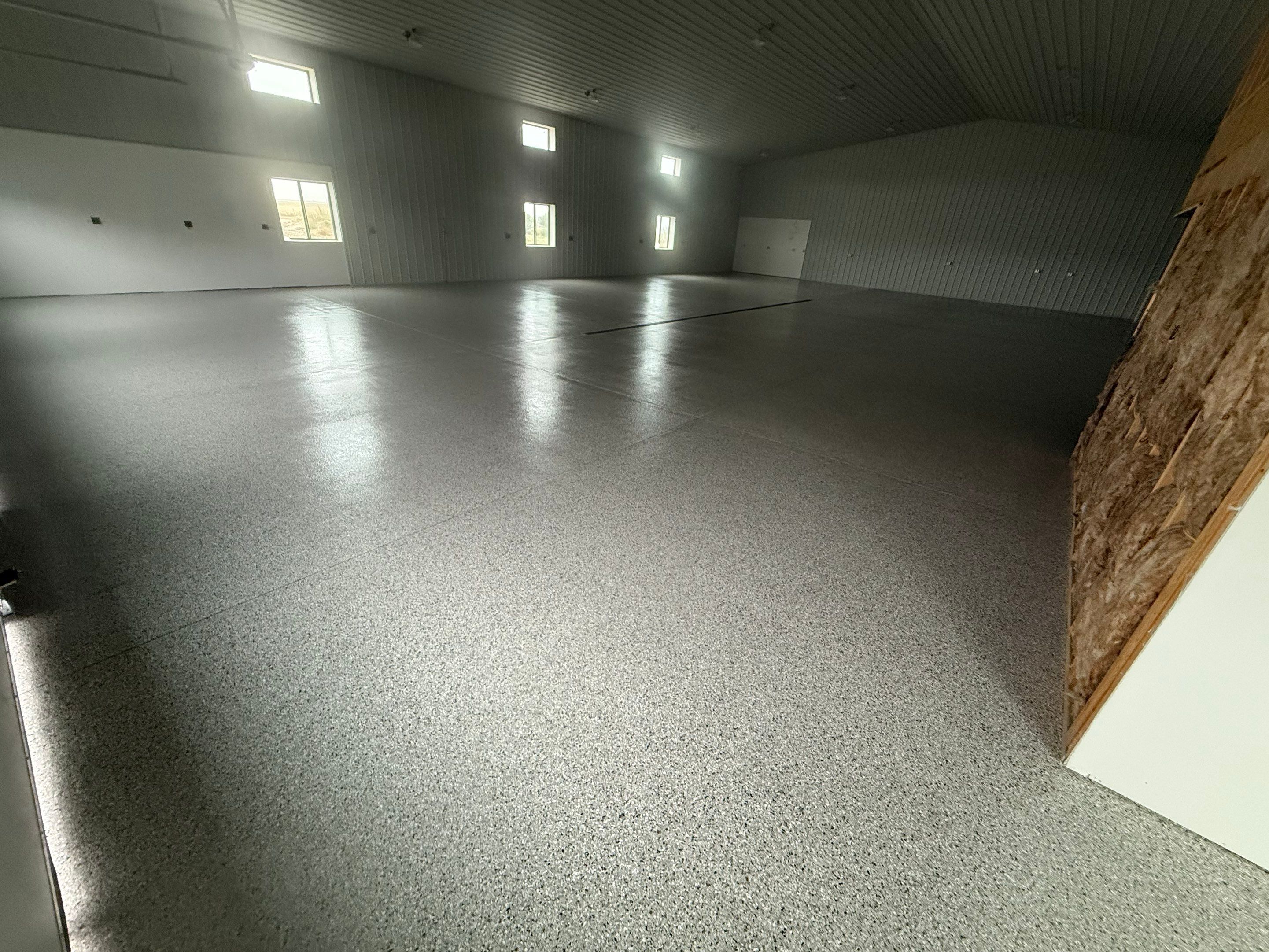 Custom Speckled Floor Coating for Large Montrose Shop by Select Painting, Coatings & Garage Cabinets