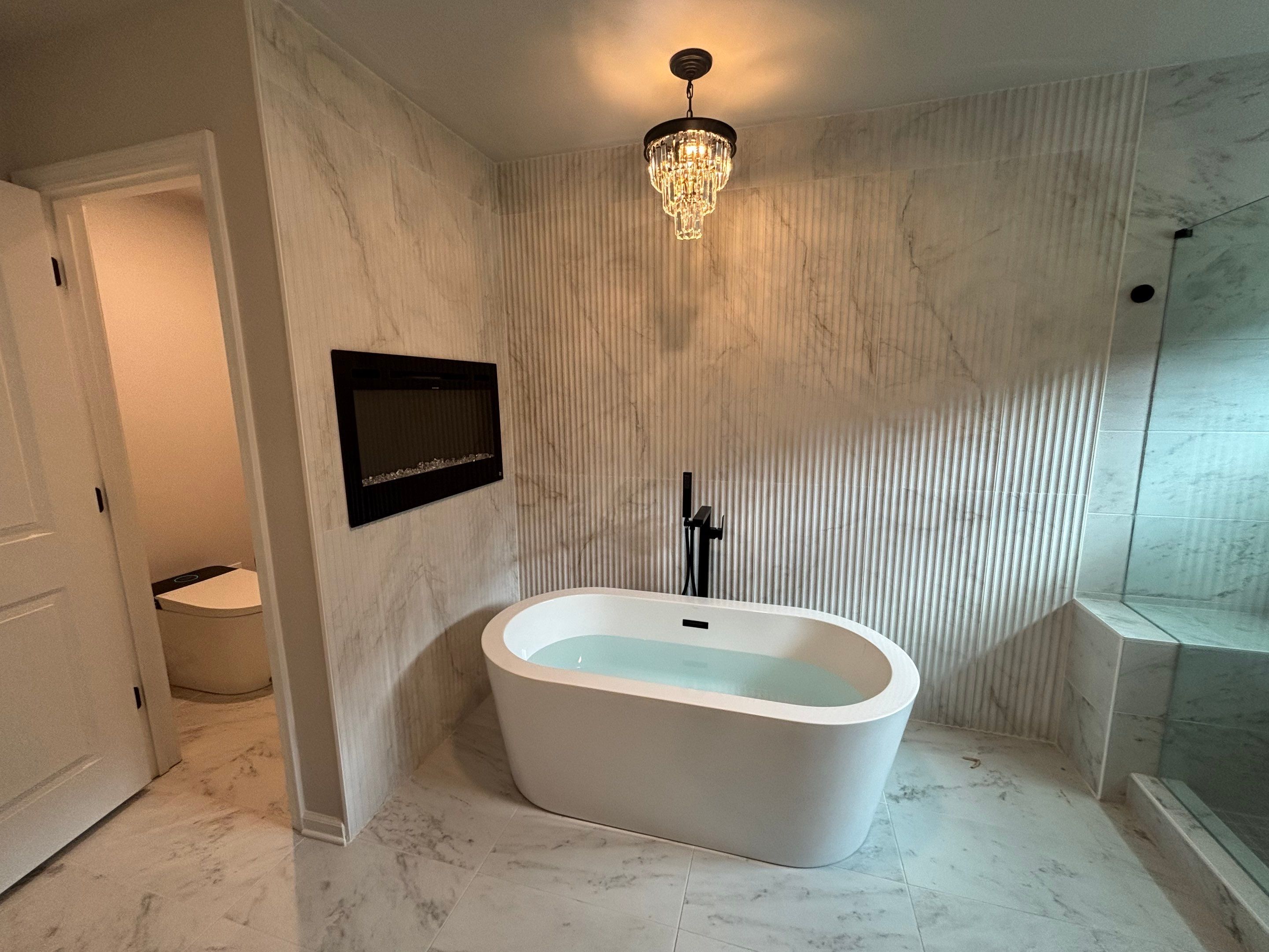 Master bathroom renovation using Free standing tub by Prudencio