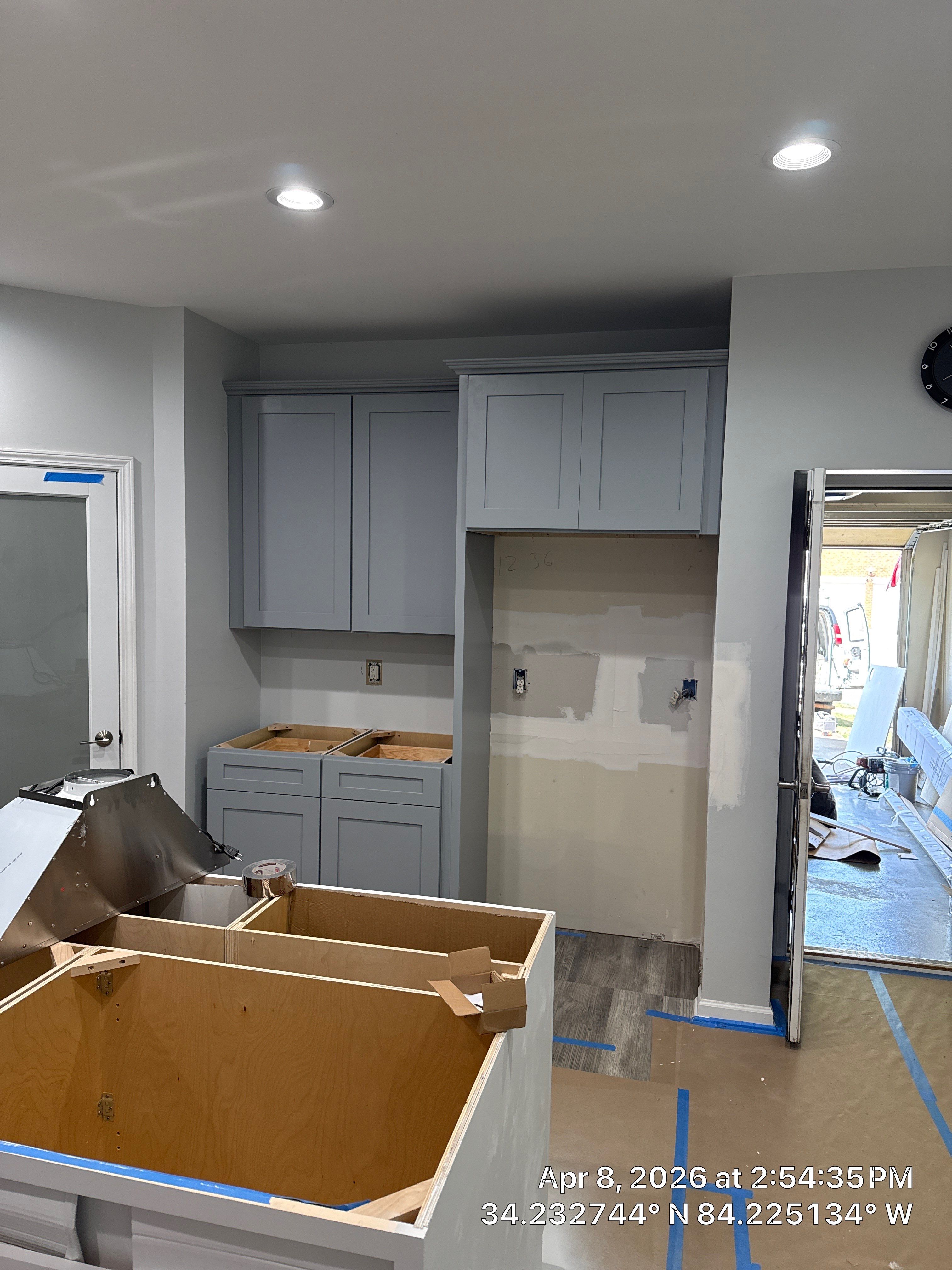 Modern Kitchen Remodel With Grey Shaker Cabinets and Navy Blue Island by Heart & Home Kitchen & Bath Remodeling LLC