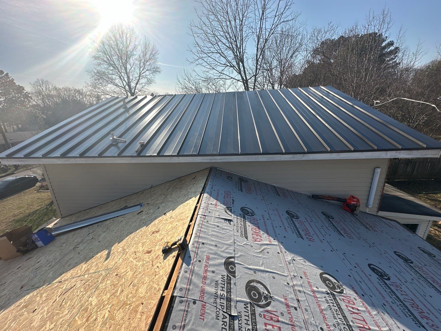 Residential Roofing Installation using Standing Seam Metal by Undersun Roofing 