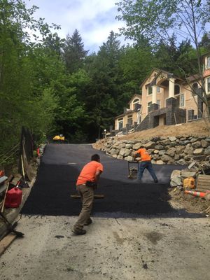 Asphalt Driveway and Stamped Concrete Patio Finish