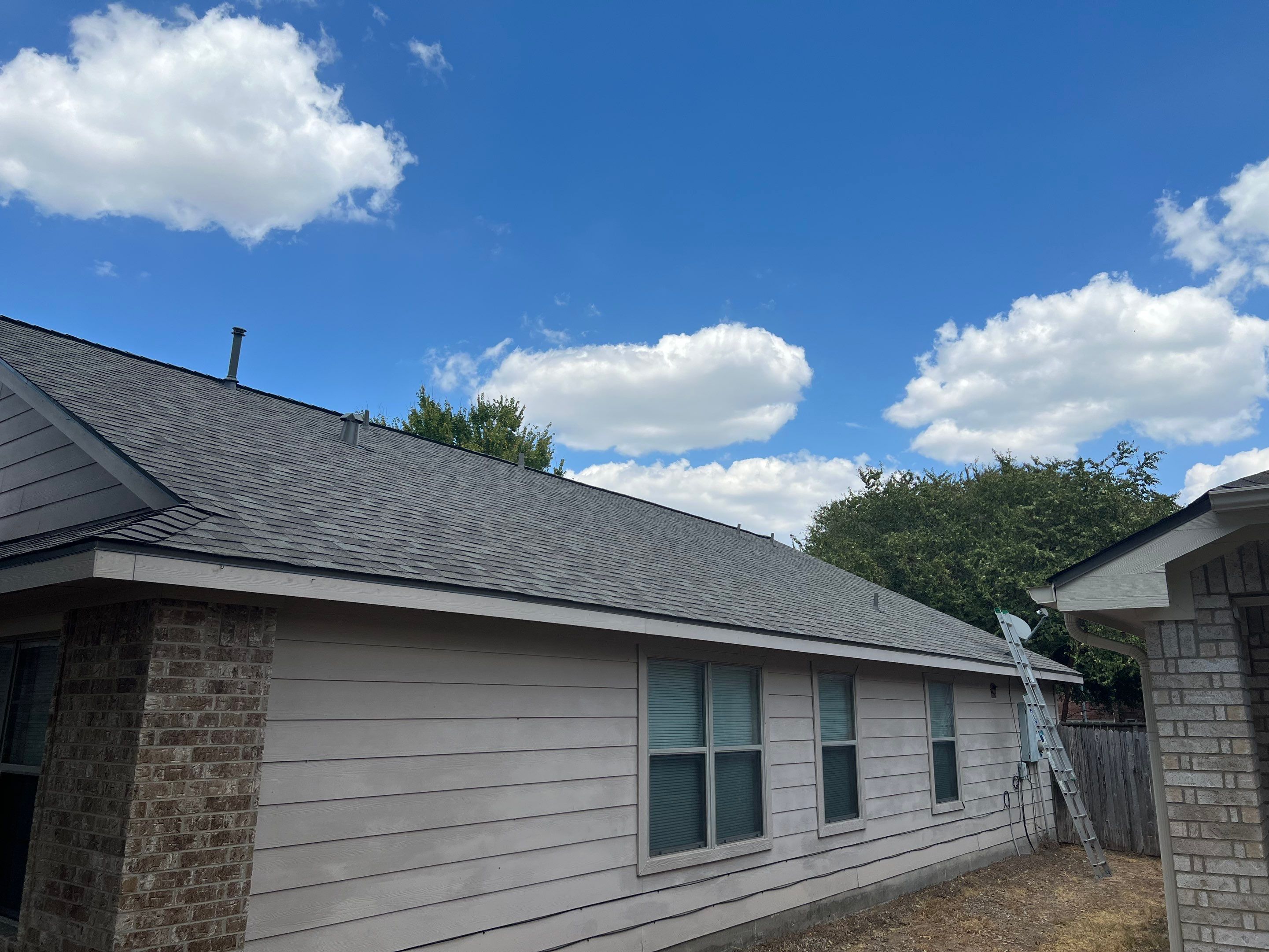 AMIG approved this roof for wind damage, fascia painting, and window work. by Roof Repair Company
