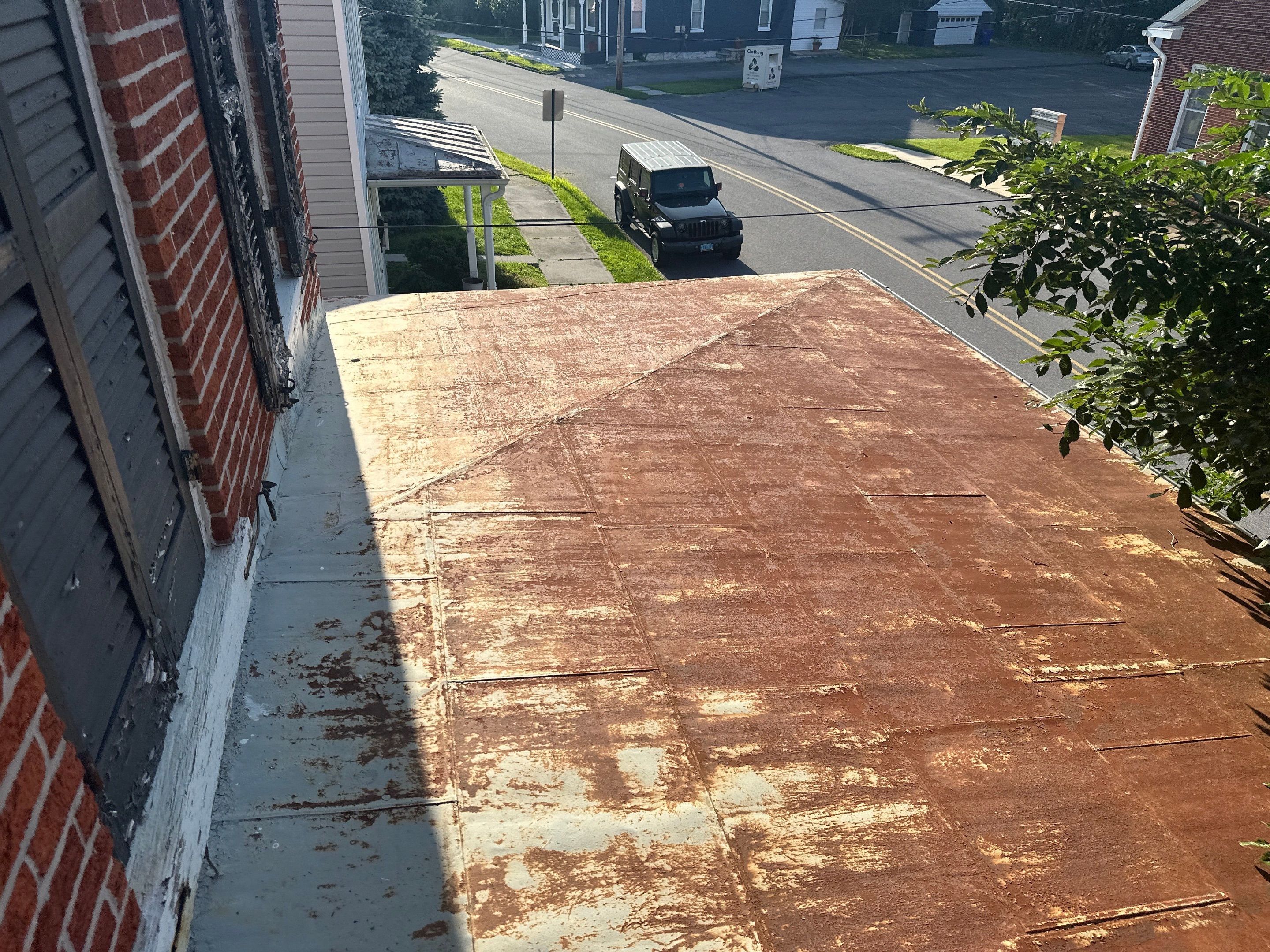 Updated Porch Roof with Clean Standing Seam Lines by Esh Builders