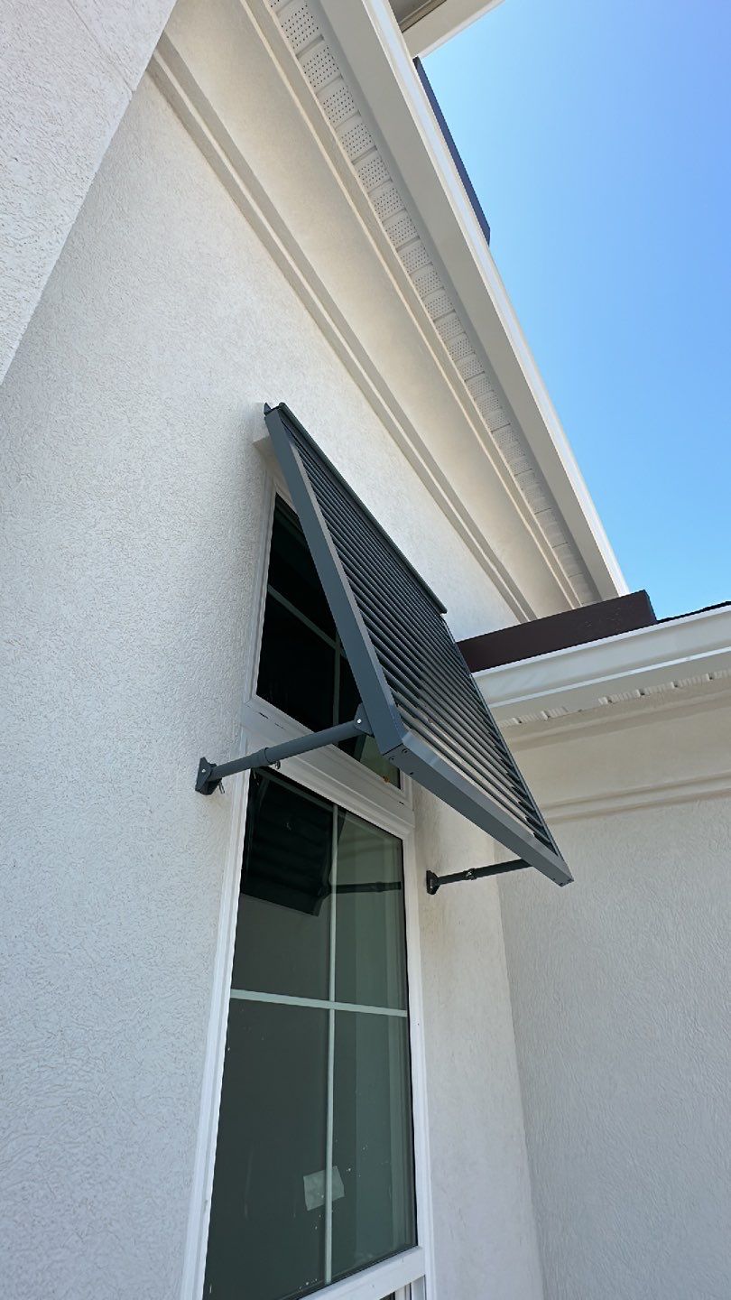 Bahama Shutters in Blue Grey  by Smart Guard Shutters