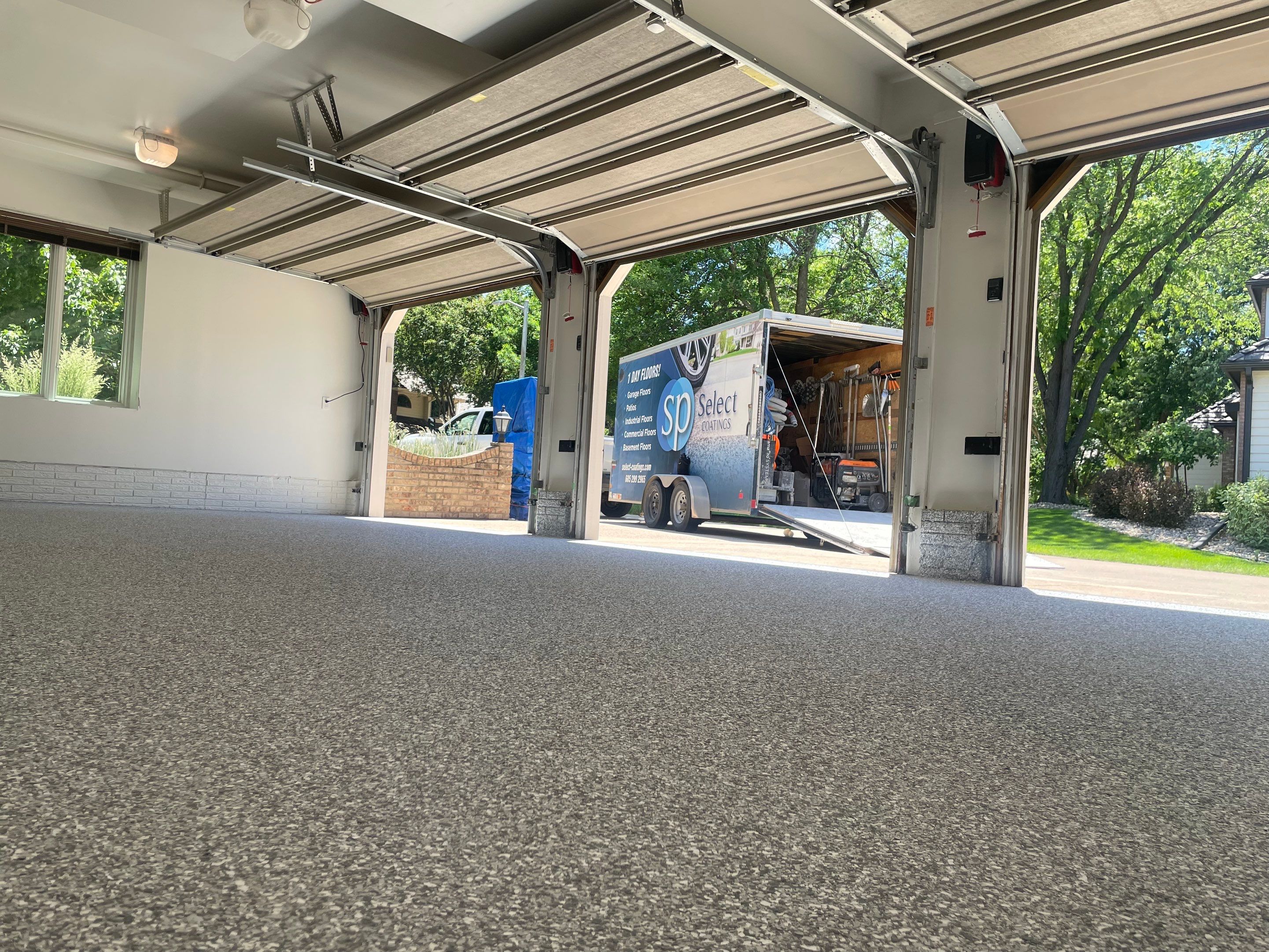 Gray Speckled Epoxy Garage Floor Coating in Sioux Falls by Select Painting, Coatings & Garage Cabinets